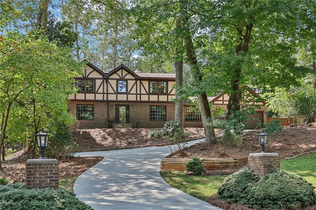 ***Beautifully Updated***Fully Fenced Yard With Deck & Lake Views***Close to Neighborhood Amenities & Lake***This stunning home offers flexible living with a front room perfect as a formal living room or office, a formal dining room, and a bright living room with a stone fireplace and easy backyard access. The updated modern kitchen features stone counters, a breakfast bar, tile backsplash, stainless steel appliances, abundant storage, and a sunny breakfast room overlooking the private backyard. A first-floor bedroom with full bath is ideal for guests or a MIL suite, plus a convenient laundry room. Upstairs, retreat to the spacious primary suite with an updated bath showcasing stone counters and a fully tiled frameless glass shower. Two secondary bedrooms share an updated full bath, with one enjoying en-suite access. The finished terrace level offers exterior access and three large flexible spaces—perfect for a media room, office, playroom, or gym. Double pane windows throughout plus 2 speed HVAC for great efficiency! Step outside to a fully fenced backyard oasis with direct access to Martin Lake! Enjoy a spacious deck for entertaining, additional patio slab for more space, lush green space, mature trees for privacy, and beautiful lake views. Neighborhood amenities include multiple pools, tennis courts, and pickleball. Enjoy lake living with all the convenience of a subdivision - book your tour today!