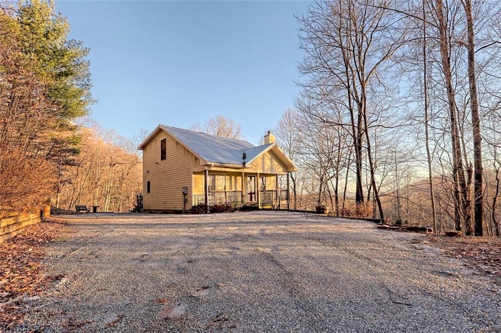 Charming mountain cottage with 2 bedrooms, 2 bathrooms, and a finished basement. This home offers ample parking & a beautiful, wooded setting with Black Rock State Park behind you and views of Tiger Mountain! There are 2 large master suites with private baths, one located on the main and the other situated upstairs. Open floor plan, cozy loft & living room with cozy wood stove and tons of natural lighting. The finished basement is perfect for a large game room or 3rd bedroom area! Location, Location, Location! 5 mins to the lovely downtown Clayton and 10 mins to Lake Burton. The charming streets of downtown offer a variety of eateries including locally sourced farm-to-table restaurants, clothing boutiques, home decor shops, and accessory apothecaries. Lake Burton rests at the foothills of the Appalachian Mountains and is surrounded by forests and mountain wildlife. Tons of outdoor activities from water sports, boating, fishing, biking, hiking, kayaking, river rafting, fly-fishing and golfing.