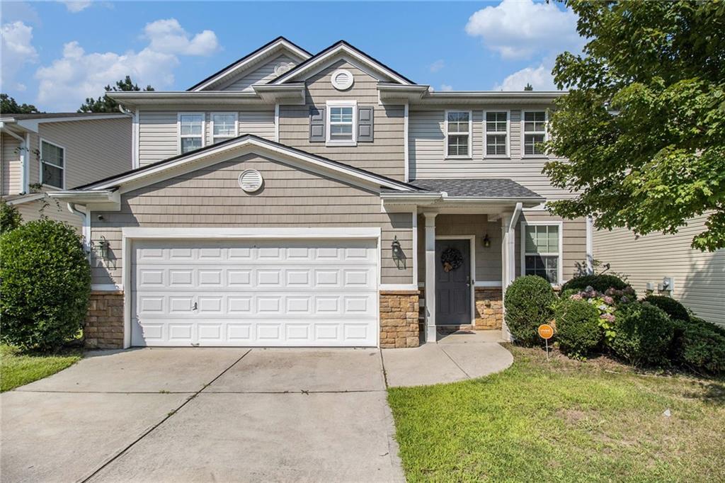 Welcome to this stunning and spacious residence, thoughtfully designed with modern amenities, energy efficiency, and comfort in mind. A brand-new roof and a high-capacity 76-gallon water heater (just 4 years old) offer peace of mind and long-term reliability. Enjoy the benefits of smart living with Google Nest thermostats, LED lighting, ceiling fans,9 ft ceilings on the main level, and a monitored security system. Sustainability meets savings with a 34-panel solar array-the largest system permitted by Georgia Power-helping to significantly reduce energy costs. Step inside to discover an expansive open-concept living area where the chef's kitchen takes center stage. Complete with a large island and abundant 42" cabinetry, it seamlessly connects to the dining and living spaces-ideal for both entertaining and everyday living. The main level features a full bathroom and a versatile bonus room perfect for a home office, playroom, or easily converted into a fifth bedroom to suit your needs. Upstairs, a spacious loft provides additional flexible living space-great for a family room, media center, or teen hangout. You'll also find four generously sized bedrooms, including an oversized primary suite with an elegant tray ceiling. The luxurious primary bath features double vanities, an updated tile shower, and a large walk-in closet for all your wardrobe needs. For added convenience, the laundry room is located upstairs, making laundry days easier and more efficient. Throughout the home, durable and stylish LVP flooring enhances the clean, modern aesthetic. This move-in-ready home is a perfect blend of space, style, and state-of-the-art features. Don't miss your chance to make it yours!