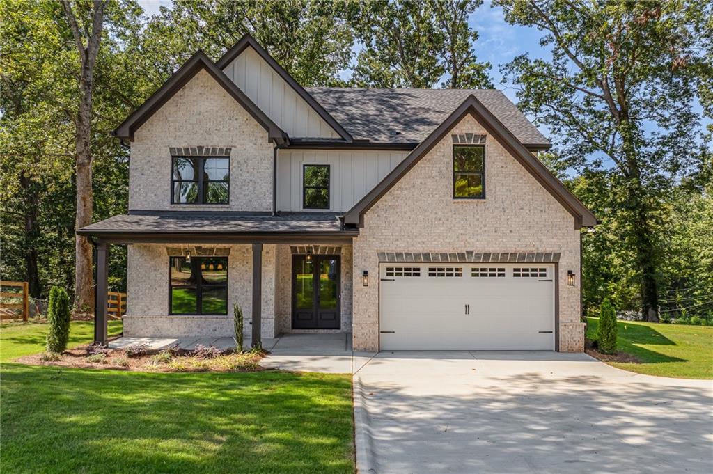 Discover this stunning new construction home perfectly located just minutes from Lake Lanier, shopping, dining, and entertainment. Thoughtfully designed in a modern farmhouse style, this home offers an open-concept layout with 10-foot ceilings and gleaming hardwood floors throughout the main level.
Enjoy hosting in the bright dining room that comfortably seats 12, and relax in the cozy family room featuring a designer fireplace. The gourmet kitchen is a showstopper with a stylish backsplash, soft-close cabinetry, a large island, quartzite countertops, and a premium range oven. A charming breakfast nook with built-in bench seating adds to the home’s appeal. A guest bedroom and full bathroom with modern finishes are conveniently located on the main floor. Upstairs, the luxurious primary suite boasts a spa-like bathroom and a massive walk-in closet with custom built-in shelving and direct access to the laundry room. Three additional bedrooms, a full bath, and a spacious media room complete the upper level. Additional highlights include a two-car garage with built-in bench and cubbies, plus a covered back patio with ceiling fan overlooking a peaceful, nature-filled backdrop. Located in one of Hall County’s most desirable areas, this home perfectly blends comfort, style, and convenience with no HOA.