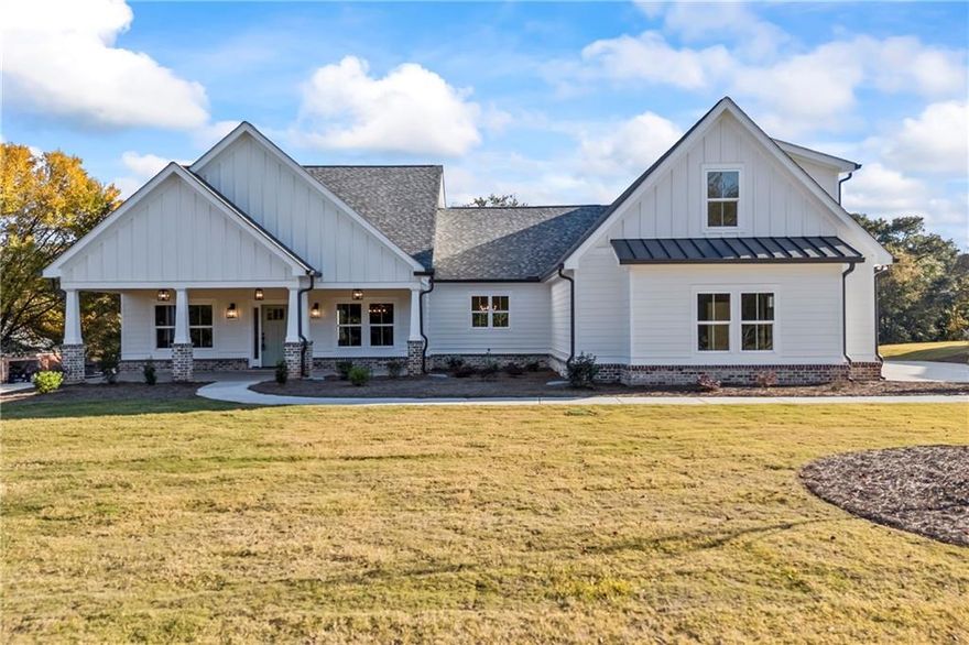 Move-In Ready! The Cohen - Introducing a Modern Farmhouse Newly Constructed in Monroe, GA nestled on 2.48 Acres. This residence offers a blend of rustic charm and contemporary luxury. Step inside to discover a thoughtfully designed interior featuring hardwood floors throughout, a master suite on the main level, complete with a spa-like bathroom, his and hers vanities, a free-standing tub, and two, custom walk-in closets. The heart of the home lies in the bright and airy gourmet kitchen, featuring quartz countertops, a pot filler, farmhouse apron sink, glass-front cabinets, a custom pantry with built-ins and herringbone brick flooring, and stainless steel appliances. Entertain guests effortlessly in the open family room, where a custom brick fireplace and reclaimed mantel create a cozy ambiance. Enjoy seamless indoor-outdoor living on the rear covered porch, perfect for al fresco dining or simply relaxing outdoors. This home also features a 2-car garage, extensive landscaping, and no HOA fees. With its blend of modern comforts and timeless appeal, this home offers a unique opportunity to experience the quintessential farmhouse lifestyle in a serene setting. Don't miss your chance to make this dream property yours. Schedule a showing today! No HOA. County Water. Ask about Builder Incentives!