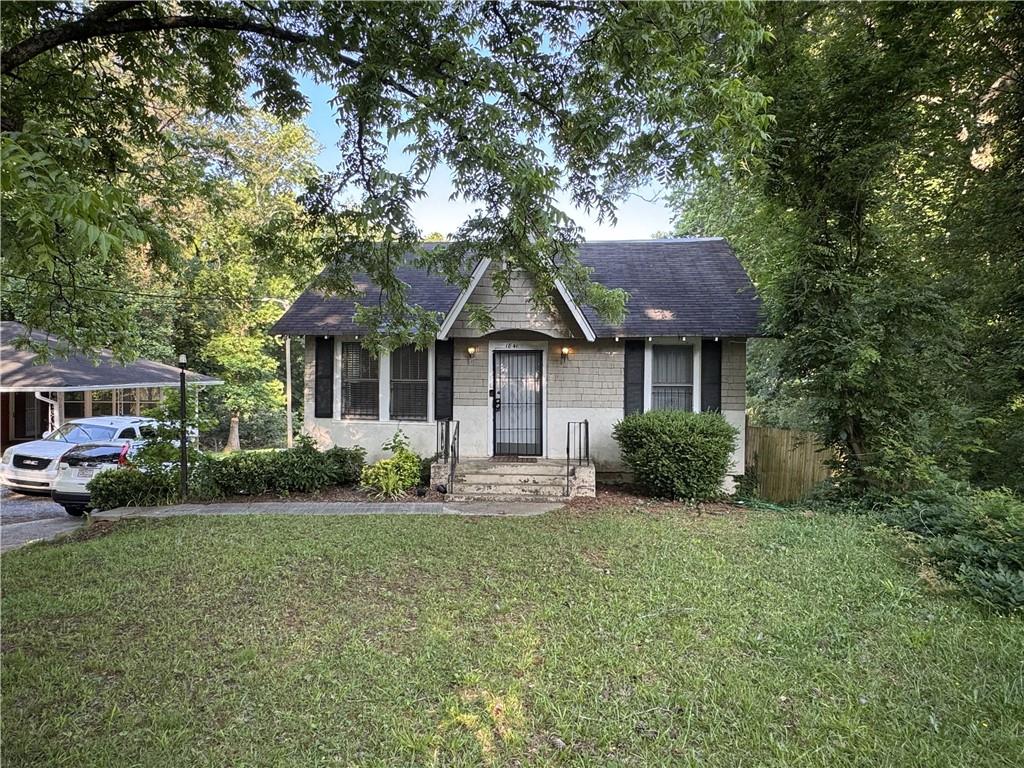 Charming Bungalow on 2+ Acres. This delightful bungalow sits on over two acres, offering both charm and potential. Original hardwood floors, and a cozy fireside family room featuring an elegant arched entry into the dining area, this home has great character throughout. The eat-in kitchen includes an open staircase leading to a fully finished terrace level.
The main level hosts two spacious bedrooms that share a full bath, while the terrace level offers a large third bedroom/bonus space and a possible fourth bedroom or office with tiled floors. Perfect for homeowners or investors alike, this property also boasts a solid rental history.
With updating, this gem will truly shine again. Don’t miss the chance to make it yours—schedule your showing today!