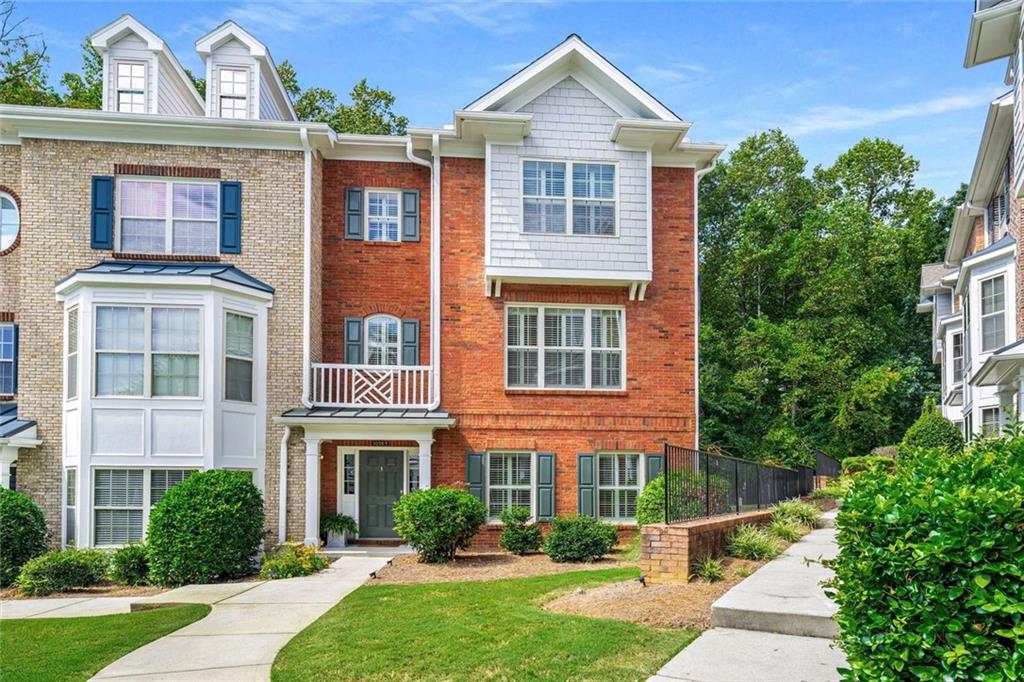 Welcome to 10265 Minion Ct — a stunning end/back-unit townhouse offering 2,500 sq ft of well-designed living space. This stately brick townhome, built in 2007, features 4 bedrooms, 3.5 baths, and a full basement, providing the ideal blend of style and practicality. Step inside to find gleaming hardwood floors, a cozy fireplace, and a kitchen outfitted with stainless steel appliances and granite countertops. The thoughtful layout includes an eat-in kitchen, private dining room, and a flexible bonus room perfect for an office or library. Outside, enjoy serene wooded views from your private rear unit, along with the convenience of a 2-car garage. Located in a gated community with a pool and maintenance-free surroundings, this property offers both privacy and community amenities. A modest HOA of $350/month includes these perks along with exterior maintenance. Ideal for families, the home lies within the State Bridge Crossing Elementary, Taylor Road Middle, and Chattahoochee High School zones. This home represents exceptional value in today's market. Enjoy the perfect setting in this community by the pool and with wooded privacy. Contact us to discover how this beautiful townhouse can become your next home.