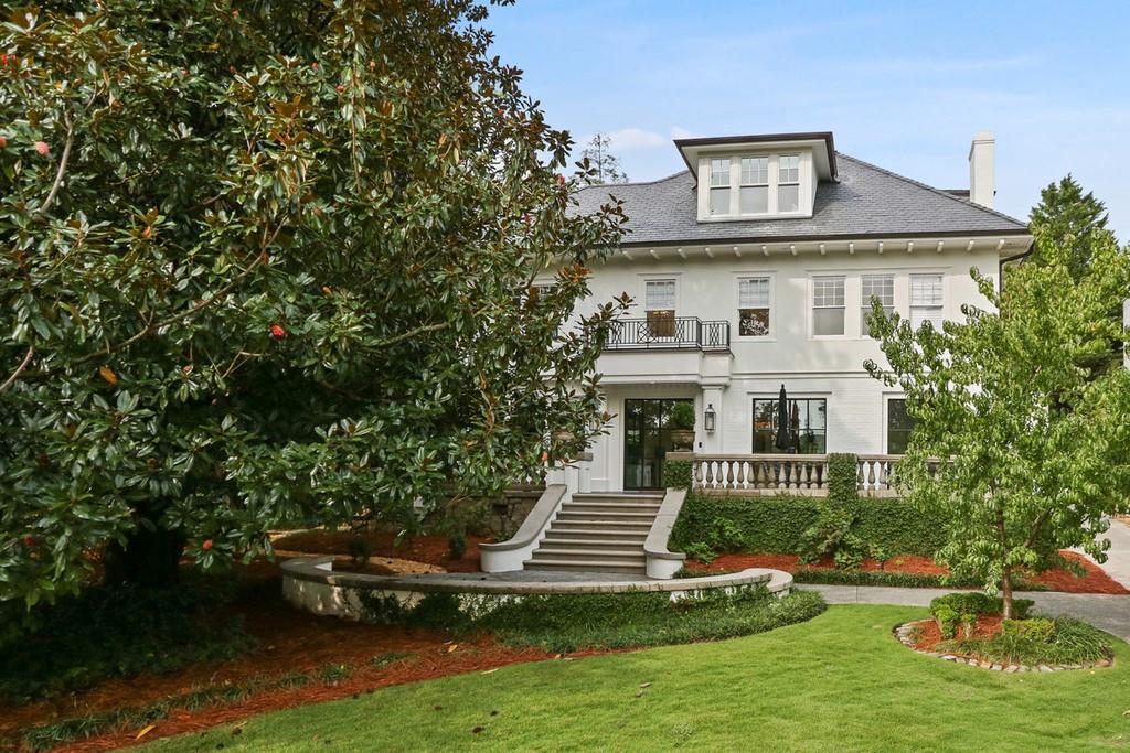 Elevated, Intown Living! Stunning renovation-expansion on a premier, corner lot in Ansley Park! Under the architectural guidance of Linda McArthur and John Willis Custom Homes, this incredible Intown masterpiece has just finished an extensive and impressive custom renovation boasting walls of steel windows and doors, a chef's kitchen outfitted with top-of-the-line appliances and adjacent scullery, Kingdom Woodworks cabinetry, a Le Cornue range, gorgeous light fixtures and the highest level of finishes throughout. Step inside to find stunning, open-concept interiors wrapped in sophistication and drenched in natural light – Upstairs hosts a gorgeous, over-sized owner’s suite with a wall of windows and a beautifully appointed bath and generous closet space. The all new 3rd floor hosts a lounge, office, bonus area as well as a guest bedroom and full bath. This incredible home is surrounded by mature landscaping, multiple patios and porches, an outdoor grilling station and plenty of privacy. An incredible opportunity just blocks from Piedmont Park, The High Museum of Art and the Atlanta Beltline.