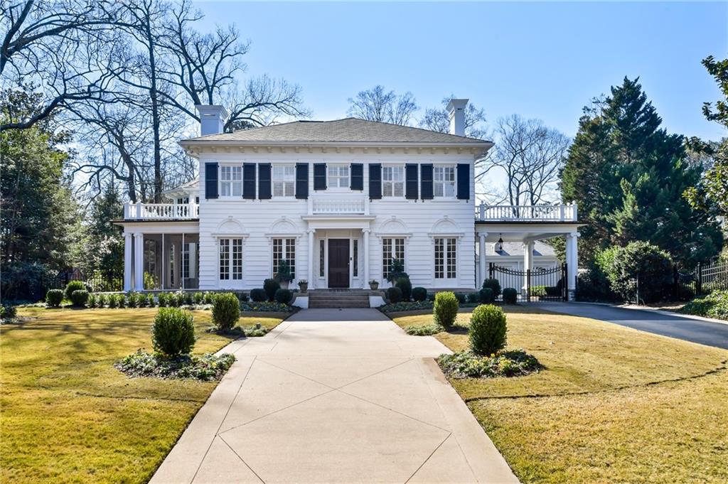 Classic traditional Brookhaven home built in the 1920s. The home is located across from the Capital City golf course. Enjoy spacious rooms with high ceilings. The extension by Norman Askins includes a reading room with heated floors, two story library with a mahogany spiral staircase, and an elevator. Kitchen opens into living room featuring SS appliances, 2 walk-in pantry’s, and wet bar. Primary suite upstairs with attached laundry plus three en suite bedrooms. On the lower level there is a guest suite, second kitchen with bar area, 1600 bottle wine cellar, sunroom, workshop and unfurnished storage. Floor to ceiling steel windows and doors from a recent expansion with tons of light and stunning backyard views. They have combined the adjacent lot with the existing property, 1.43+/-acres of level land. Simply gorgeous, the exterior grounds are truly fabulous including a John Sanders sculpture, 75+ specimen rose garden, 2 inviting firepits & a pavilion with private views of the rear/adjacent waterfall. The large grotto has gas lanterns, an additional bathroom, greenhouse, and pool. There is detached 3 car garage with plans drawn for a potential guest house and plenty of off street parking. This house is perfect for large gatherings and can easily accommodate any event formal or informal.