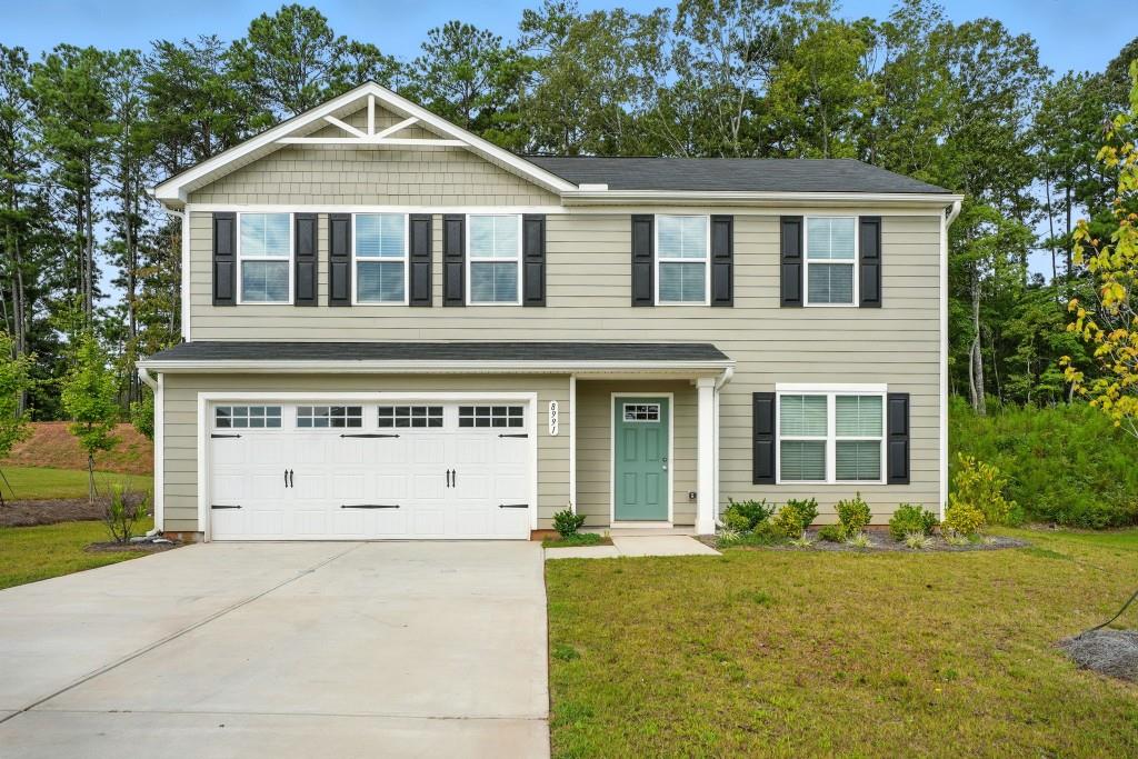 Built in 2024, this stunning 4-bedroom, 2.5-bath home offers modern comfort and style. The open-concept layout features a spacious main level with a versatile flex room, perfect for an office or playroom. The kitchen is beautifully appointed with stained cabinets, granite countertops, and overlooks the dining and living areas. Durable HardiePlank siding, a slab foundation, and a level yard provide low-maintenance living. Don't miss this opportunity to own a like-new home with thoughtful details throughout