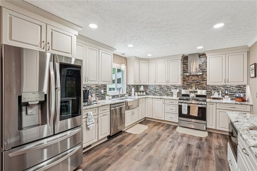 ***NEW ROOF***

This well-located home, just minutes from Town Center and Sprayberry High School, offers a perfect blend of comfort and style with 4 bedrooms and 2.5 bathrooms. Renovated in 2021, this home is move-in ready. 

The spacious main level features an updated kitchen that seamlessly connects to the living and dining areas, creating an inviting atmosphere for family gatherings and entertaining. The kitchen is equipped with granite countertops, stainless steel appliances, and 42" cabinets, offering plenty of storage. Thoughtful touches, like a spice rack next to the stove and a dedicated K-cup drawer for your coffee station, make it both functional and convenient. Under-cabinet LED lighting and recessed lights provide a bright, airy feel, while the large island adds extra storage and a microwave cabinet. Durable LVP flooring on the main level is waterproof and scratch-resistant, ensuring long-lasting durability.

The dining room provides easy access to the large, fenced backyard, perfect for outdoor activities. Enjoy relaxing or entertaining on the 15x15-foot deck, or unwind in the separate screened-in porch featuring a ceiling fan and LED lighting, offering year-round comfort. 

The lower level is equally impressive, featuring a cozy family room with a stone fireplace and ample natural light. This level also includes a fourth bedroom, which could easily serve as a guest suite or home office, a bonus room, and a half-bath for added convenience. The laundry room is located here as well.

Upstairs, the primary suite offers a peaceful retreat, while two additional spacious bedrooms and a full bathroom provide plenty of room for family or guests. The upper level is finished with beautiful hardwood floors, adding warmth and character to the home.

This well-maintained property is larger than it appears and offers generous living space for a growing family. With recent renovations and thoughtful details throughout, it’s a home you’ll want to see in person to truly appreciate its full potential.