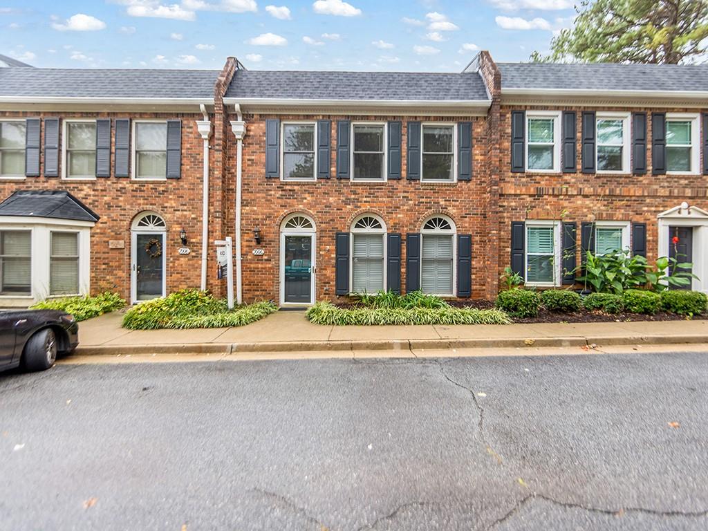 Walk to Downtown Roswell! Updated Townhome with New Roof & Fresh Paint. Beautifully maintained and move-in ready townhome located less than half a mile from Downtown Roswell. Features include fresh interior paint, open living and dining areas, and a bright sunroom with new siding (2021). Recent updates include a new roof (2025) and new water heater (2022) for added peace of mind. Enjoy low-maintenance living with low HOA dues that cover trash, recycling, and yard maintenance. The community offers plenty of guest parking and a convenient location close to shopping, dining, and entertainment. This home has been tastefully updated and can be sold furnished if the buyer wishes to purchase the furniture separately.
