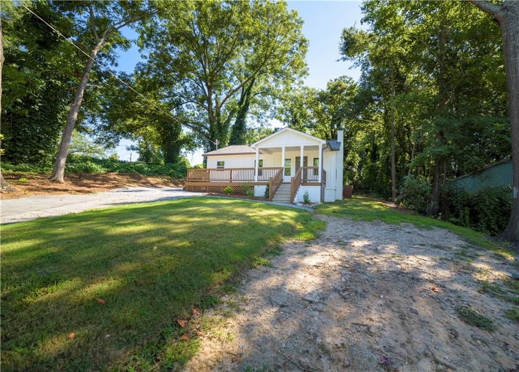 Located right in the heart of downtown Toccoa, this charming ranch style home is within walking distance to local stores and just minutes from all your favorite restaurants, offering the perfect blend of convenience and community. Minuetes away from Toccoa Lake & Toccoa Falls College. Nestled in a quiet and welcoming neighborhood, this completely renovated two bedroom, one bath residence is ideal for a couple or small family seeking comfort and modern living. Every detail has been thoughtfully updated inside and out, featuring a brand-new roof, cement siding, windows, insulation, and Sheetrock, along with updated plumbing and electrical systems throughout. The interior boasts spacious rooms with fresh paint, new flooring, and recessed lighting that adds a warm and contemporary touch. The fully renovated kitchen showcases stainless steel appliances, new cabinets, sleek countertops, and ample storage space. The bathroom has been tastefully redesigned with a tiled shower, quartz countertop vanity, and new light fixtures for a fresh, upscale feel. Additional upgrades include a new A/C unit, water heater, and a huge front porch perfect for relaxing outdoors. The property offers a big front yard with two entry points and a flat backyard, providing plenty of space for outdoor enjoyment. Don’t wait to view this amazing property. Schedule your showing today!