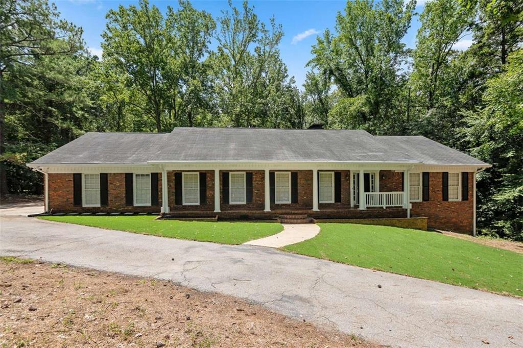 Tucked in an established Fairburn community, this four-sided brick gem offers timeless curb appeal.. Enjoy a side-entry 2-car garage, inviting front porch, private fenced backyard, and both an open deck and a screened-in back porch, perfect for relaxing year-round. Inside, discover elegant spaces including a formal living and dining room, breakfast nook, gas range, laundry room, and a finished basement with private exterior entry for added versatility. This home blends character, comfort, and convenience schedule your showing today!