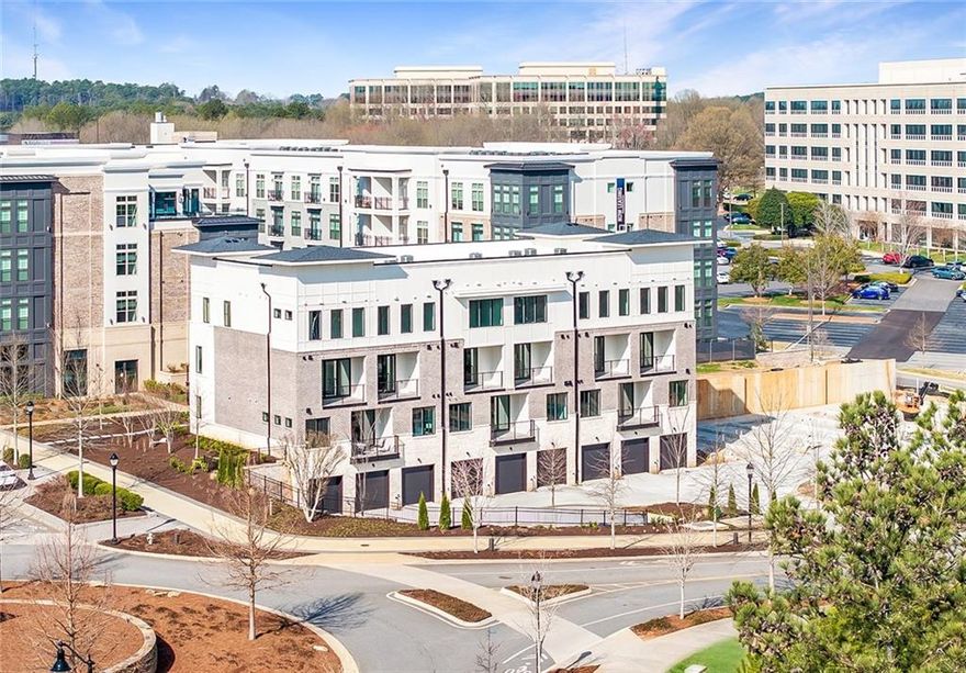 Welcome to your new stacked townhome style floor plan in Monte Hewett's newest condo neighborhood in walkable Alpharetta, Findley Row, where you now have a new price if you sign an agreement by October 31st plus $10,000 Seller paid closing costs towards HOA dues or rate buydown. This is a true lifestyle opportunity to find your new home built by the same builder from Avalon, Halcyon and many other well-known neighborhoods.  Located on the Alpha Loop and a short distance to Avalon, downtown Alpharetta, the North Point district and the Big Creek Greenway, this luxurious home offers the highest end finishes with low maintenance living and easy access to GA-400. The exterior and interior details are just what you will love in Monte Hewett's amazing designs and higher end than other new construction in the area. You will enjoy White Oak Hardwood floors throughout the home, Quartz countertops in the Kitchen and bathrooms, Bell custom cabinetry throughout the home, tile to the ceilings in the bathrooms and so much more. You will love the main level that has a completely open floor plan from the Family room to the Kitchen and Dining. The Kitchen features a large island with stacked cabinetry to the ceiling, soft close doors and drawers, plenty of room for entertainment and great storage space. You will also enjoy the walkout covered patio on the main floor with a storage area. Upstairs are two generously sized bedrooms with walk-in closets and private baths. The professionally designed bathrooms are the perfect color combinations. The oversize two-car tandem garage offers private and convenient parking with tall ceilings that are perfect for storage with an electric car charger outlet. Findley Row is located in Northwinds Summit that will feature a luxury hotel, retail, dining and office space, as well as very convenient access to GA-400. Enjoy the Alpharetta location without the local traffic by jumping on the Alpha Loop to walk or bike to great restaurants, events and shopping. Get in at the beginning of the community for the additional $10,000 towards your closing costs. Contact us to schedule a private showing and experience the exceptional lifestyle you will enjoy in Findley Row!