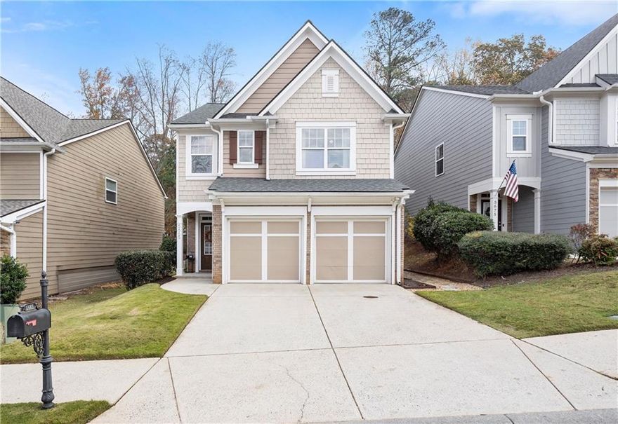 Move-In Ready, Well-Maintained Home with Numerous Upgrades! Warm and inviting, this spacious home offers comfort, style, and functionality. The main level features engineered hardwood floors, freshly painted kitchen cabinets, and a bright, open layout filled with natural light. The laundry room on the main level showcases on-trend tile flooring, and both the main-level half bath and secondary upstairs bath feature new cabinetry. Enjoy outdoor living with a walk-out level, fenced backyard, patio, and new French drain system (side and back) for improved drainage. The front yard features lush zoysia grass. Major updates include a roof (2022), water heater (2020), 2 new HVAC 2021/2023 and sliding glass door (2019). Interior walls are freshly painted in the popular Repose Gray color, adding a modern, cohesive touch. This home is has been professionally cleaned, is move-in ready and beautifully maintained!  The Stonehaven Pointe community offers a clubhouse with fitness room and meeting rooms, pools for adults and children with a waterslide, basketball court, playground, several tennis courts and you are only 1.5 miles to GA 400!