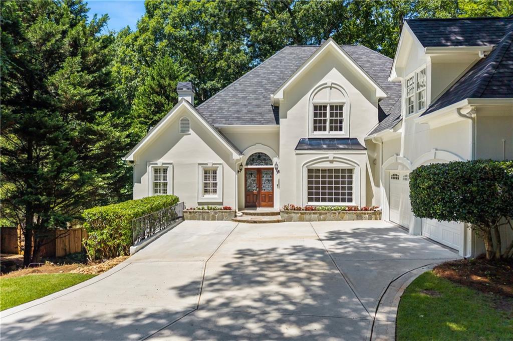 Tucked away on a quiet cul-de-sac in Roswell's sought-after Hadfield swim/tennis community, this beautiful and spacious home is the total package! Large square footage for the neighborhood with the master on main, a fully finished terrace level with a bed/bath, and a large, flat backyard perfect for kiddos to play with the option to add a pool! This home is an entertainer's dream and a personal retreat all in one. Inside, you'll find soaring ceilings, tons of natural light throughout, charming trim work throughout, a freshly painted interior, separate dining, two living rooms both with their own fireplace, and a spacious main-level primary suite with a walk-in closet, separate his/her vanities, a beautiful soaking tub by the fire, and private access to the expansive rear deck. The main floor also includes a half bath, hardwood flooring, and recessed lighting. The finished terrace level is ideal for multigenerational living, private office, or hosting out-of-town guests with a bed and bath, lots of additional storage, workshop, plus private access to the backyard oasis. Located within one of Roswell's top-rated school districts and just minutes from Brookfield Country Club and Downtown Roswell. Schedule your showing today and make this home your own!