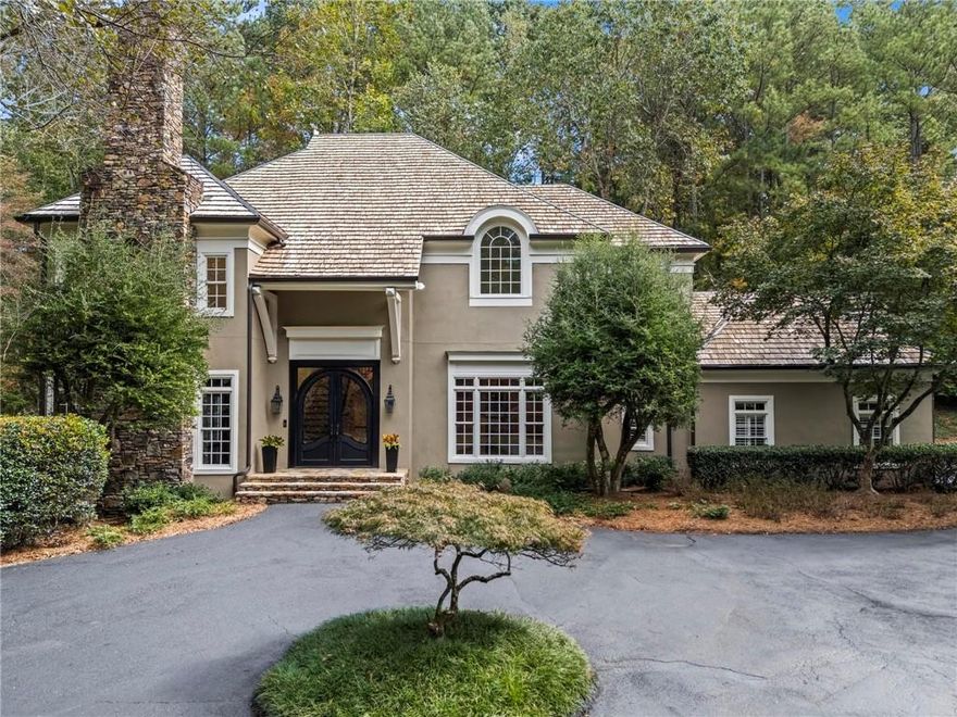 Bill Harrison designed European beauty in Sandy Springs.  Welcome home to your very own resort complete with swimming pool and tennis/pickle ball court.  Gated entry welcomes you home to this hardcoat stucco home on a quiet, peaceful street bordering Buckhead without City of Atlanta taxes.  Convenient to all the private schools and minutes to shopping, restaurants and the Chattahoochee River.  Soaring ceilings throughout. Kitchen and master bath were both completely renovated less than 5 years ago with no detail missed.  Top of the line kitchen appliances, white oak island and gleaming hardwoods throughout majority of home and beautiful Saltillo tile in the terrace level living areas.  Full house generator, dry sauna, gym and fenced backyard. No lack of storage.  This one is not to be missed!