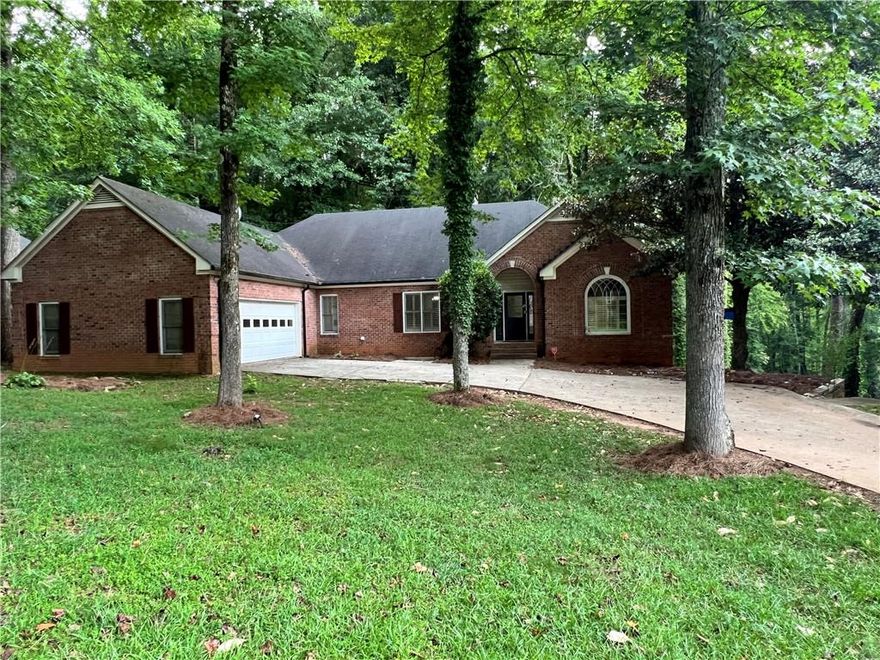 Step into spacious living in this beautiful 5-bedroom, 3.5-bath home located in the sought-after Hamptons Grant Subdivision. The main level features a primary suite with a private bath, a fireside family room, a separate Living Room, a separate dining room, and a kitchen with plenty of room for a breakfast nook—ideal for gatherings and everyday living.  The finished basement offers incredible versatility with its own entrance, kitchen, laundry area, bedroom, bathroom, and bonus room that can be used as a second living area or additional bedroom—perfect for guests, in-laws, or a recreation space.  Home is situated on a quiet cul-de-sac. Located within the award-winning Forsyth County School District and close to great shopping, dining, and parks, this home combines comfort, convenience, and community all in one.