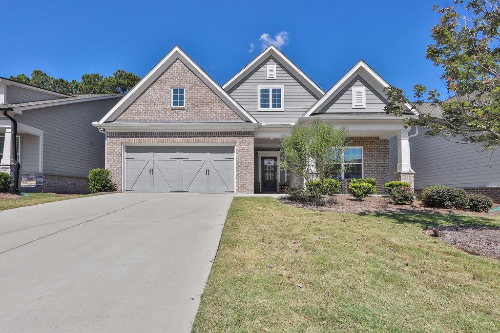 Welcome to 567 Barlow Place— 55+ community where modern comfort meets timeless charm in the heart of Grayson! Built in 2021, this beautifully maintained 3-bedroom, 3-bath home offers over thoughtfully designed living space. The open-concept layout features a spacious family room with a masonry fireplace, a gourmet kitchen with premium finishes, and generous natural light throughout.
Enjoy a luxurious primary suite with a walk-in closet, plus two additional bedrooms and a loft perfect for family or guests. The attached garage, central air, and wood siding add both convenience and curb appeal. Situated on a quiet street with a low noise level, this home is just minutes from top-rated schools, shopping, and dining.
Whether you’re looking for a peaceful retreat or a vibrant community, this property delivers.