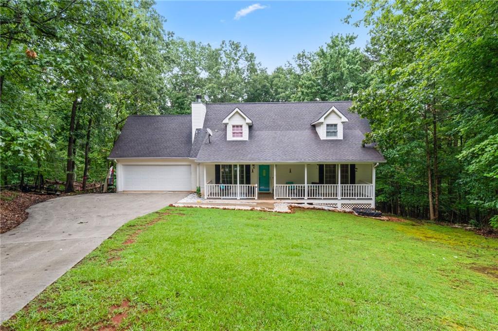 Located in the highly sought-after Sky Country neighborhood, this charming 3 bed / 3.5 bath home offers 2,158 sq ft on the main levels plus a finished basement with bonus room—ideal as an in-law suite with its own sink, cabinets, and private space. The main level features a spacious living room with a gas fireplace, a bright kitchen with a double oven, and a large master suite with HUGE walk-in closet, double vanities, separate commode, and a shower/tub combo. Laundry and master are both on the main floor. Enjoy morning coffee on the inviting front porch or entertain on the back deck overlooking a fenced-in 0.74-acre lot. All closets are extra deep for incredible storage, and the basement includes both finished living space and an unfinished room perfect for storage. BRAND NEW HVAC, and just minutes to shopping, schools, and downtown Dahlonega—this one checks all the boxes!