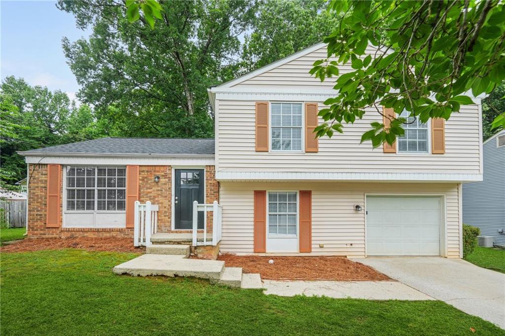 Welcome to 1432 Shenta Oak Drive – Move-In Ready & Full of Charm! This beautifully updated home offers the perfect blend of comfort, convenience, and style—all just minutes from I-85, the Farmer’s Market, local dining hotspots, shopping centers, and scenic parks. Step outside and notice the brand-new roof, freshly power-washed exterior, and the charming Magnolia tree that adds both beauty and shade. Inside, you're greeted by a foyer entrance that opens to a spacious family room filled with natural light, new carpet, and fresh paint throughout. The renovated kitchen features white cabinetry, granite countertops, a breakfast bar, and stainless-steel appliances—ready for all your culinary adventures. Adjacent to the kitchen, the formal dining room with brand-new LVP flooring provides the ideal setting for gatherings with family and friends. Downstairs, a cozy sunken family room with a fireplace offers the perfect space for a media room, home office, or play area. You’ll also find a convenient laundry room and access to the garage with additional storage. Step out onto the brand-new deck overlooking the fully fenced backyard—your private oasis for grilling, relaxing, or entertaining under the open sky. Upstairs, the primary suite boasts granite counters, a new vanity, and generous closet space. Two additional guest bedrooms and an updated full bathroom complete the upper level. Additional upgrades include a new furnace, a newer water heater, and fresh paint and flooring throughout the home.