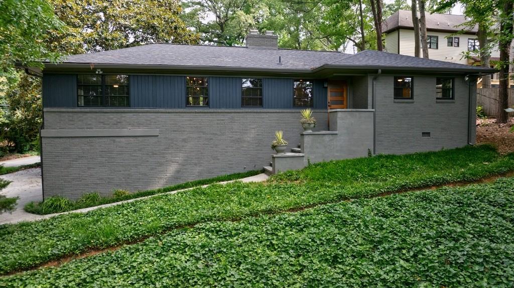 Enjoy this newly renovated 3 bedroom 2 bath Mid-Century Modern home located in the prestigious High Point neighborhood. Top-notch renovation throughout. Bathrooms feature hand-tiled walls, floor, showers, and all new fixtures. New kitchen has been thoughtfully redesigned showcasing Kraftmaid cabinetry, quartz countertops, breakfast bar and coffee station with bring new LG appliances throughout. Hall laundry utilizes a sleek sliding door closure system to hide stacked LG washer and dryer units. Levelor blinds throughout adjust to control the light-filled rooms. Additional modern cabinetry in the expansive family room can be used as a bar or buffet serving a second dining area. Moder 3-blade fans with lights in family room and all bedrooms. MCM "Sputnik" dimmer-controlled ceiling fixture in dining room. Property is across the street from Windsor Meadows Park and is situated on a corner lot with two driveways/parking areas accessible from Northway Drive. Minutes to the GA 400 Glenridge connector and Chastain Park. Owner provides landscape maintenance.