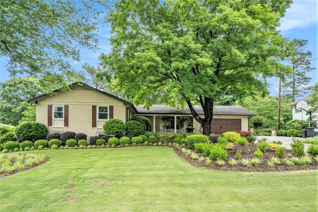 Stylish Brick Ranch in Highly Sought-After East Cobb - Welcome to Stratford! Discover the Perfect Blend of Comfort, Style, and Community in this Beautifully Updated Home located in one of East Cobb's Most Desirable Neighborhoods Stratford, a Swim & Tennis Community known for its Friendly Atmosphere, Mature Trees, and Prime Location. Tucked away in a Peaceful, Well-Established Subdivision, yet just minutes from Premier Shopping, Top-Ranked Schools, and Major Highways, this Marietta Gem offers the Lifestyle you've been looking for. Whether you're commuting to Atlanta or enjoying the charm of East Cobb, Stratford puts you in the center of it all with easy access to I-75, I-285, Sandy Springs, and Downtown Atlanta. Step inside to find a Warm and Inviting Interior filled with Thoughtful Updates. Gleaming Hardwood Floors, Classic Crown Molding, and a Light-Filled, Open Concept Fireside Family Room welcome you home. Just beyond, a Stunning Sunroom with Floor-to-Ceiling Windows and Sophisticated Stone Tile Flooring offers a Serene Spot to Unwind, Entertain, or Soak in the Views of your Private Backyard Oasis. The Updated Kitchen is the Heart of the Home, featuring Rich Stained Cabinets, Granite Countertops, Stainless Steel Appliances, and a Seamless Flow into the Family and Dining Rooms Perfect for Hosting Gatherings or Enjoying Quiet Nights In. A Formal Dining Room sets the stage for Elegant Dinner Parties or Holiday Meals. The Spacious Primary on Main Bedroom is a Peaceful Retreat with an Updated Ensuite Bathroom that boasts a Gorgeous Stone Shower, Stylish Vanity, and Multiple Closets. Two Additional Bedrooms and a Full Bath complete the Main Level, offering Flexibility for Guests, Family, or Office Space. Downstairs, the Daylight Terrace Level Expands Your Living Space with a Large Second Living Area, Built-In Wet Bar, and Private Exterior Entrance Ideal for a Teen Suite, In-Law Living, or Extended Guests. This level also features Two Bedrooms, a Full Bathroom, and a Dedicated Office plus ample space for a Playroom, Gym, Media Room, or whatever your lifestyle demands. Outside, enjoy your Private, Fully Fenced Backyard with Lush Landscaping, a Charming Fountain, and Plenty of Room to Garden, Grill, or Relax Year-Round. The Spacious Deck is Perfect for Morning Coffee or Evening Wine under the Stars. A Two-Car Garage adds Convenience and Extra Storage. Residents of Stratford enjoy Optional Swim & Tennis Amenities and a True Sense of Community. Just moments from Terrell Mill Park complete with Playground, Sports Fields, Pickleball, and Tennis Courts you'll never run out of things to do close to home. Don't miss your opportunity to live in a Beautifully Updated Home with Room to Grow, in one of East Cobb's Most Convenient and Coveted Communities!