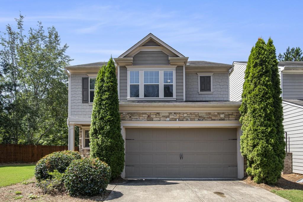 Tucked away at the end of a quiet culdesac in a desirable Alpharetta neighborhood, this beautifully maintained home offers privacy, curb appeal, and an ideal floorplan. With 3 bedrooms, 2.5 baths, and 2,166 square feet of living space, you'll love the open layout, freshly painted interior, and move-in-ready condition. The main level features hardwood floors, an open dining room with picture frame molding, a bright office/study, and a spacious family room with a cozy fireplace. The kitchen is equipped with granite countertops, stainless steel appliances, a breakfast bar, and views into the family room perfect for entertaining. Upstairs, the vaulted owner's suite boasts a spa-like bath with double vanities, tiled floors, a separate garden tub and shower, and a generous walk-in closet. Two additional vaulted bedrooms, an upstairs laundry room, and a large bonus area complete the second floor. Enjoy the peaceful, fenced backyard and the charm of the home's gorgeous exterior featuring stacked stone and cedar shake accents. All in an unbeatable location close to top-rated schools, parks, and shopping. This is the one you've been waiting for!
