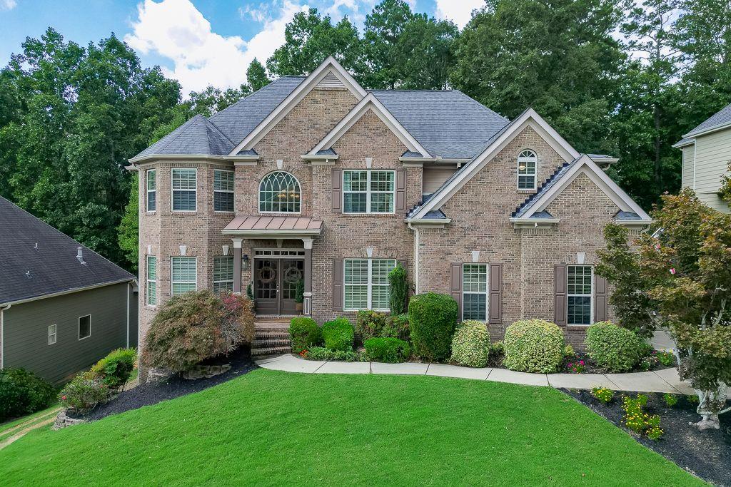 Welcome to your dream home in the highly sought-after Seckinger High School district, Gwinnett County's premier new AI-focused academy! This stunning residence offers two master suites, a finished basement, and a gorgeous open kitchen featuring a brand-new gas range. The newly remodeled master bathroom is a true retreat with dual shower heads and a luxurious 71" freestanding soaking tub. Enjoy natural light streaming through tons of windows that give the home a grand, open feel. Step outside to your backyard oasis with a brand-new jacuzzi, firepit area, and serene wooded views. The neighborhood is equally impressive, offering a community pool and welcoming atmosphere. With space to entertain, modern upgrades throughout, and unbeatable school district placement, this home checks every box.