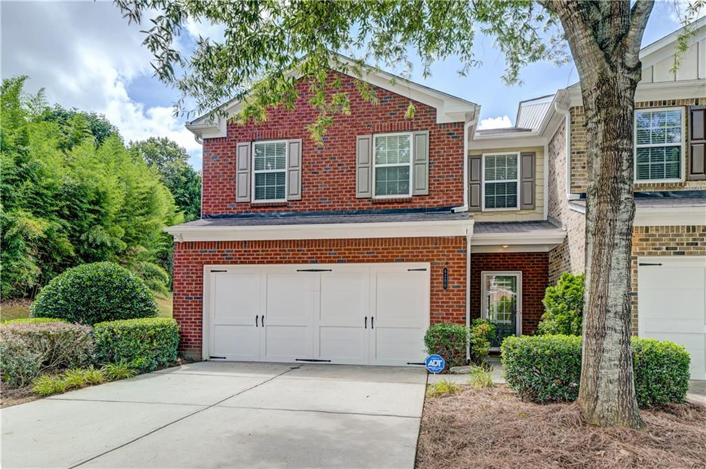 Welcome to this stunning end unit fee simple townhome in the highly sought-after gated community of Bellewood located in the top-rated Parkview, Trickum and Arcado school districts. Boasting the largest floorplan in the subdivision, this meticulously maintained 3 bedroom, 2.5 bath home offers a perfect blend of space, comfort and luxury. The open main level features gleaming new hardwood floors, a spacious family room with a cozy gas-log fireplace and a dining area that opens to a private patio and lush green lawn. The kitchen is beautifully appointed with maple cabinetry, granite countertops and a breakfast bar ideal for casual meals or entertaining. Upstairs, enjoy a versatile loft/media/office area, an expansive primary suite with spacious walk-in closet and a spa-like ensuite bath featuring a soaking tub, separate shower and stone finishes and two generously-sized secondary bedrooms. Additional highlights include new paint and carpet, new HVAC in 2024, new water heater in 2023, wide crown molding and end unit privacy. Bellewood's gated community amenities include a swimming pool and playground. Conveniently located with easy access to I-85, Hwy 78 and all that downtown Tucker has to offer, this home truly has it all. Don't miss your opportunity to live in one of Gwinnett's best townhome communities!