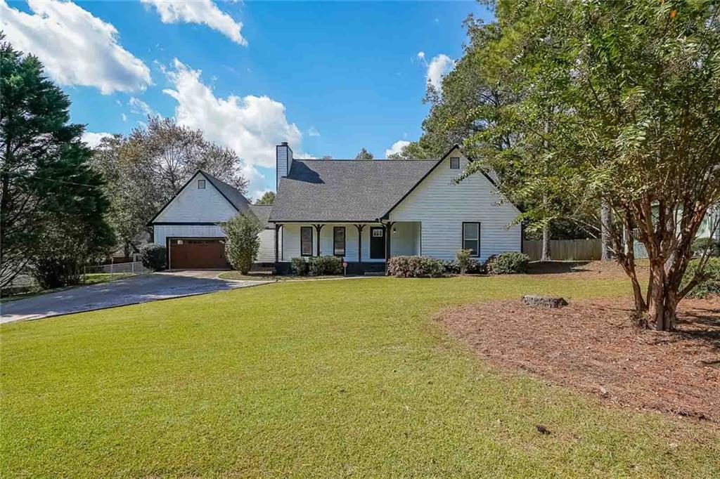 Nothing to do but move in! Greet your friends and sit a while on the welcoming rocking chair front porch of this southern charm beauty. Peacefully nestled on a large level lot in a well-established friendly community with NO HOA. Inside will not disappoint. You'll appreciate the practical layout with tons of natural light. Entertain in casual style in the vaulted great room graced with a lovely fireplace. The formal dining room will be the place you will gather with friends and family to make those wonderful memories. Escape to the spacious master retreat with dual vanities and tub/shower combo. All large secondary bedrooms provide privacy for guests or plenty of room for family sleep and play. With mature plantings and a nice amount of green grassy space for play, the outdoor space will not disappoint. Enjoy peaceful crisp air mornings on your screened-in porch or lazy day weekends in the spacious, fenced-in backyard- perfect for kids, pets and those family gatherings! FULLY FURNISHED. NEW Roof and HVAC. Move in today and start making memories tomorrow!