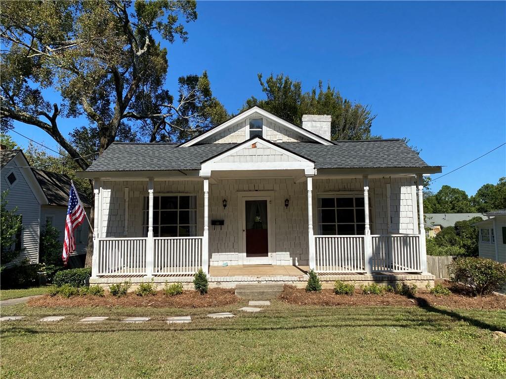 LOCATION!! .5 miles to the Marietta Square... driving, riding or walking are options from your front door step!
Sit on your front, side or either back porches in your quaint, historic home in City of Marietta. Main level has two primary bedrooms, one with on suite half bath and one with large sitting room. Upper level has a flex room currently furnished as an additional bedroom. Home comes with fully finished lower level in-law or guest suite with separate exterior entrance. Laundry, kitchen and full bath available in both units!