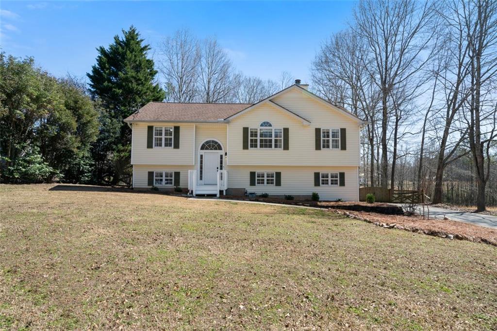 Welcome to this beautifully maintained 3-bedroom, 2-bathroom home, move-in ready and offering a perfect blend of comfort and style. The spacious eat-in kitchen features a tile backsplash and ample cabinet space, ideal for cooking and entertaining. The walk-in pantry is sure to please. From the kitchen, step out to the large back deck, which overlooks a large, fenced backyard oasis that boasts a backdrop of the surrounding nature. The main living space is sunny and cozy and complete with a gas fireplace! The primary suite is a true retreat, boasting his-and-hers walk-in closets, a double vanity, and a tiled shower. The two secondary bedrooms are generously sized, each with its own walk-in closet, providing plenty of storage and comfort for family and friends. The lower level offers a large bonus room that can easily serve as a fourth bedroom, playroom, or home office— versatile and spacious for all your needs. You'll also find a great-sized closet for additional storage! The oversized 2-car garage includes exterior access for added convenience. Step outside and discover your own backyard haven, featuring a new deck, a covered patio, a firepit area, and a two-level storage building—providing both beauty and functionality. Located minutes from I-20 and close to Douglasville and Villa Rica- a commuter's dream! This home is offered fully furnished, making it a rare and easy move-in choice for any buyer. Don’t miss the opportunity to make this beautifully maintained gem yours. Schedule a private tour today!