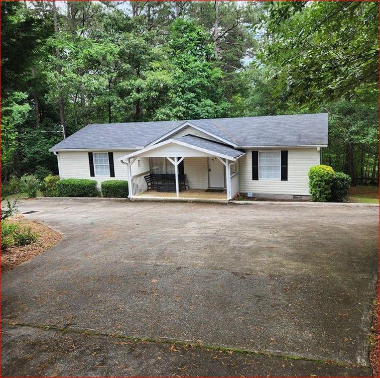 Available July 5th -
Discover your dream home nestled in nature! Great schools !
This charming 3-bedroom, 2-bathroom residence offers a perfect blend of comfort and
tranquility. Enjoy the spacious open living area, ideal for family gatherings and entertaining. The large kitchen boasts ample counter space
and modern appliances, perfect for the home chef. Each bedroom features walk-in closets, providing plenty of storage. Relax on the
covered front porch, where you can soak in the serene wooded surroundings. Privacy abounds in this peaceful retreat, making it a haven
for nature lovers. Don’t miss the chance to make this beautiful home your own!