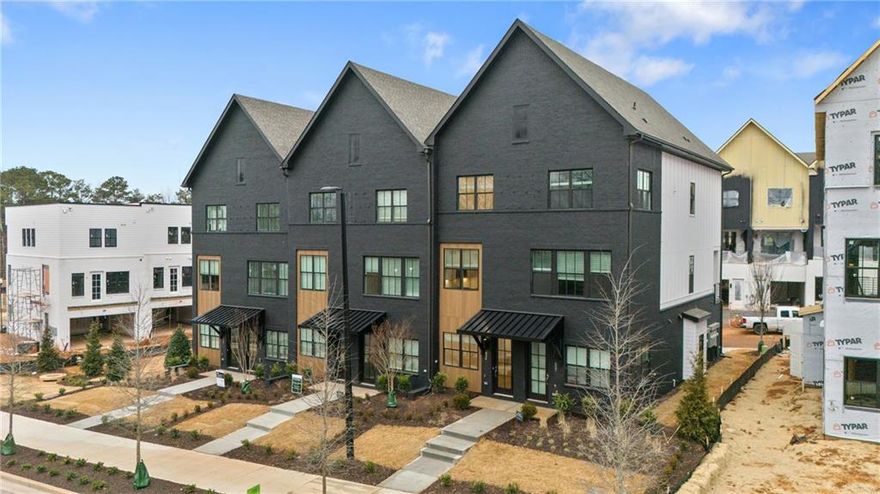Welcome to The Anniston at The Gathering, a stunning Contemporary style townhome designed for modern living. This beautifully crafted home offers 1,644 square feet of thoughtfully designed space, features two bedrooms, a flex space, and three luxurious bathrooms, perfectly blending comfort and style. As you enter the Anniston you will find a versatile terrace level that includes a cozy flex space, a full bathroom, and convenient access to the garage. Ascend to the main living area on the second floor, where 10-foot ceilings and an open-concept layout seamlessly integrates the kitchen, dining area and living room. The gourmet kitchen showcases quartz countertops, KitchenAid appliances and maple cabinetry. This space is perfect for entertaining guests or enjoying a quiet evening at home. Step out onto the deck off the living area to enjoy fresh air and outdoor relaxation. The third floor is dedicated to restful retreats. The primary suite boasts a walk-in closet and a well-appointed bathroom featuring double vanities, quartz countertops and a glass shower providing a serene sanctuary. A second bedroom, complete with its own full bath, offers comfort and privacy for family members or guests. The Gathering is a vibrant new community, just minutes from downtown Alpharetta, Avalon and top-rated schools as well as prime access to the Alpha Loop. This home provides the ultimate in modern suburban living. Experience the perfect combination of style, comfort and convenience!! This home is estimated to be complete by February 2025. The photos in the listing are not images of the actual home. This is offered as representation of the floorplan and colors/design will vary.