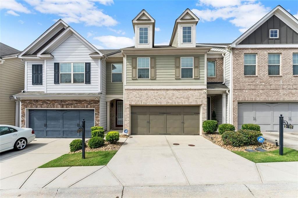 ake a tour of this spacious townhome in a beautiful swim/tennis community featuring 3 bedrooms, 2 1/2 baths, and a FENCED BACKYARD! This home has updated finishes with modern lighting and a dramatic living room accent wall. The extended foyer leads to an open-concept design that seamlessly connects the spacious kitchen with lots of cabinetry, walk-in pantry, dining area with seating for up to 6 persons, and living room with fireplace-perfect for relaxing or entertaining. You'll also find the powder room on this level, along with a 2-car garage. Upstairs, you’ll find three generously sized bedrooms and two full bathrooms as well as the laundry room. The stunning oversized primary suite offers a sitting area, spacious walk-in closet, en-suite bathroom with dual sinks and separate soaking tub and shower. The HOA covers both front and backyard lawn care, amenities and pest control. The community amenities include swimming pool, tennis courts, clubhouse and sidewalks, grass areas, park benches and guest parking in this well-kept community. The location is ideal within just minutes to Hartsfield-Jackson Airport, shopping, dining, parks and major highways, as well as close proximity to Trilith in Fayetteville for easy entertainment! If you're looking for a low maintenance home at a great price, without the brand new price tag, this move-in-ready townhome checks all the boxes!