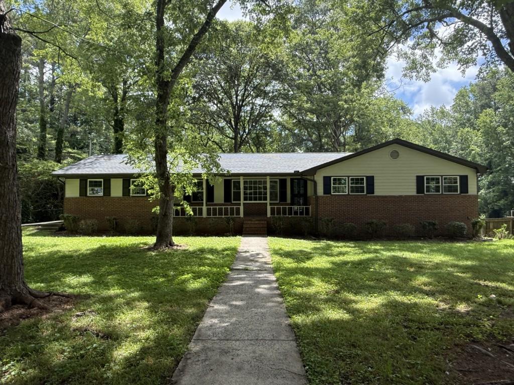 Price improvement!!! Welcome to your family's next home! This beautifully updated 3-bedroom, 2-bath ranch sits on a spacious corner lot almost half an acre in a quiet, friendly neighborhood in Marietta. Located in the highly sought-after Harrison High School district and just minutes from Dallas Highway, this home offers both comfort and convenience. Step inside to find a bright and welcoming interior with fresh paint inside and out. The family room features a cozy fireplace perfect for movie nights or relaxing after a long day. The kitchen has been thoughtfully updated with brand-new countertops, a new stovetop, and a new dishwasher ready for family meals. All bedrooms are generously sized, and the updated bathrooms add a fresh, modern touch. Outside, the large fenced backyard is ideal for kids, pets, and weekend gatherings, with plenty of room to play or garden. The side-entry garage provides extra privacy and curb appeal, while the brand-new roof adds peace of mind. Close to parks, schools, shopping, and dining, this home is move-in ready and made for family living. Agent-owned schedule your showing today!
