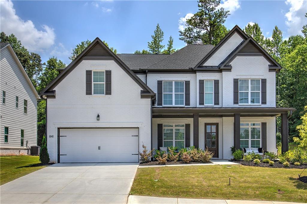 Welcome to this stunning, custom-crafted residence nestled on a desirable northeast-facing lot in the sought-after Vista Ridge subdivision of Woodstock. This 5-bedroom, 5.5-bath masterpiece blends refined elegance with everyday comfort, offering exceptional upgrades and thoughtful design throughout.
Step inside to discover hardwood flooring throughout all main living areas, a seamless open floor plan, and a flood of natural light. The gourmet kitchen is the heart of the home, boasting luxurious Silestone Et Dor countertops, an oversized island, gold hardware, double ovens, a pot filler, and top-of-the-line JennAir appliances—perfect for both casual dining and entertaining. A butler's pantry adds convenience and charm, connecting the kitchen to a formal dining area.
Every bedroom is a private retreat, complete with its own en-suite bathroom. The downstairs guest suite features a walk-in shower, ideal for visiting friends or multigenerational living. The home office offers a quiet, stylish workspace, and custom light fixtures throughout add a sophisticated touch.
Enjoy a level backyard, perfect for outdoor entertaining, or play—all framed by the tranquility and beauty of this prestigious neighborhood. Neighborhood amenities also include a pool, clubhouse, and playground.
Don’t miss your chance to own one of Vista Ridge’s finest homes—where luxury, location, and lifestyle come together seamlessly.