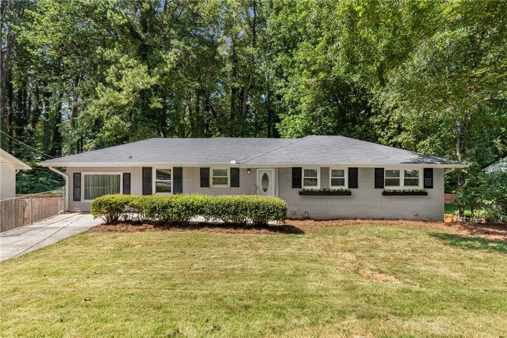 OPEN HOUSE: Saturday, August 2nd from 2-5 pm Recently updated 4 bedroom & two full baths and kitchen – with +1,100 square feet of unfinished basement space with a full bath provides room to grow and immediate home equity opportunity. The main floor of this mid-century 4BR/2BA ranch home boasts new marble-style quartz countertops, white shaker-style cabinets, new stainless steel gas range, dishwasher and microwave and refrigerator. New farm sink and tile backsplash. New wide-plank LVP flooring throughout the main floor, new lighting and ceiling fans along with fresh paint make this home move-in ready. ROOM TO GROW: LARGE UNFINISHED BASEMENT with a full bathroom, a den with fireplace and two additional rooms and a separate egress from the driveway make this home perfect for growing families or even an investor looking to create a separate living space for rent. PRIVATE BACKYARD - Enjoy large freshly painted deck off the living room, overlooking the private backyard. Large carport and extra parking pad inside fenced back of home. NEIGHBORHOOD: Home is located in Creatwood Forrest - just 400 yards from Smyrna’s newest park - Creatwood Park! Here you are only mins from downtown Smyrna, The Braves Stadium at The Battery, Cobb Galleria Mall and all the shops and entertainment Atlanta has to offer!