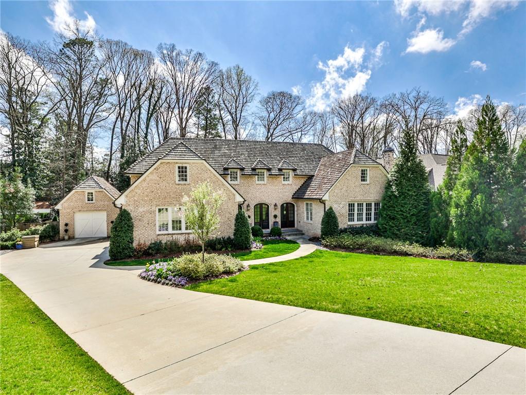 Chastain Park Stunner! Expansive custom home in the heart of the neighborhood. Main level features Master on Main, open modern floorplan with kitchen, family room all open to a walk out backyard with resort style pool and screen porch. Upstairs has 4 large bedroom suites with a central living space. Lower level has private guest quarters, media room, dining area and side yard outdoor space with a fire pit. Seriously one of the best homes around, don't miss out!