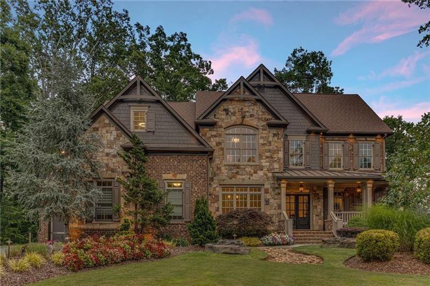 Discover this unique opportunity to own an exquisite lakefront home in a premier gated community just minutes to 400.  Although this property is .62 acres, it is surrounded on three sides by Corp of Engineer property, creating the ambiance of a private 5-acre retreat. This property offers a billion-dollar view year round; something you have to see in person to truly understand, with stunning year-round lake views and an impressive 180-degree view of the lake in the fall. Just steps away from your door, you’ll find your very own private, deeded boat slip. Enjoy nightly sunset boat rides on quiet, deep water or take a short boat ride to great places to eat like Pelican Pete’s, Pig Tales & Twisted Oar. 

Meticulously maintained, this home is more than move-in ready; it is a perfectly cultivated escape to a serene haven of luxury, comfort, and modern convenience. If you have been waiting for “the one,” you have found it.  A perfect decision for your family, providing a fantastic place to grow up. Children will enjoy life on the water end enjoy the community and safety this vibrant neighborhood has to offer. This is the place where your grown kids will want to return and visit, creating memories for generations to come.

6065 Anchorage Quay is situated is situated at the end of cul-de-sac of a private enclave of homes in the esteemed Anchorage section of St Michaels Bay. This home exudes curb appeal with its professionally designed landscape that sets it apart. As you walk past the beautiful Japanese Maple and through the double front doors, your eyes will be drawn to the panoramic lake views through the soaring two-story wall of windows. The home features designer touches throughout, including hand-selected high-end light fixtures, paint selections, and boutique-hotel-style carpeting. The beautiful coffered ceilings in the great room enhance the sense of spaciousness. 

The heart of the home is a gourmet kitchen with brand-new Viking appliances, perfect for both everyday cooking and entertaining. The open floor plan flows seamlessly, creating a comfortable and stylish living space. Upstairs, the peaceful lake views continue in the owner's suite, which also boasts a recently remodeled bathroom with a soaking tub and separate shower. Two additional en-suite bedrooms upstairs provide ample space and privacy for family or guests. A fourth bedroom on the main floor adds versatility. All bedrooms have recently added custom-built closet systems.

The large covered porch is perfect for enjoying sunsets and unwinding after a long day. The uncovered deck extension is an ideal spot for grilling and entertaining during summer holidays, the Super Bowl, or the Masters Tournament. The fully finished basement is a dream, with a spacious living area, a bedroom with a full bathroom, a gym space, and plenty of room for gatherings. Don't miss the 1,000-bottle wine room and full bar, making this the perfect spot to entertain friends and family. 

The expansive backyard features lush zoysia grass that feels like carpet on your feet. It's ready for you to create the pool of your dreams. Enhance your outdoor living experience with a Sonos sound system that plays throughout the entire house and outside at the fire pit, which overlooks the serene lake. Venture down to the lake for fishing or kayaking in a quiet part of the lake. In the evening, the landscape lighting illuminates the grounds in all the right spots.

Don’t miss the chance to own this distinctive home with unmatched views and exceptional amenities.