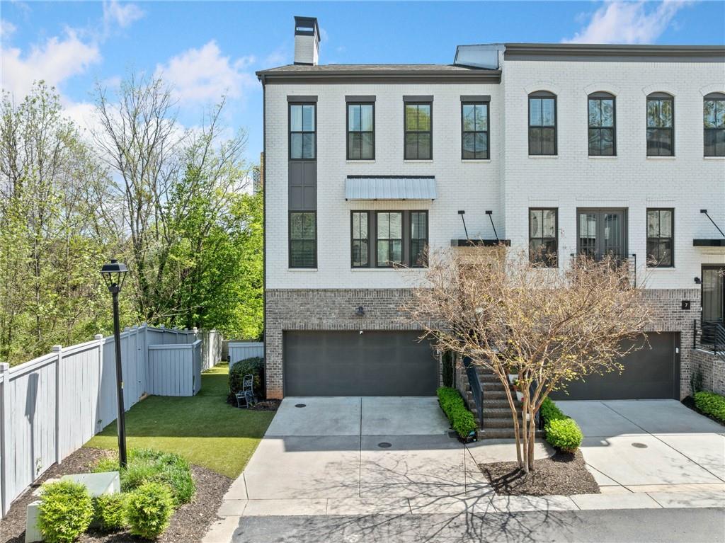 Welcome to this stunning end unit townhome with a spacious and fenced astroturf yard. The main level has a 2 car garage and a master sized bedroom with an en-suite bathroom 2 closets and private deck. Take the steps down to the custom finished terrace complete with a wet bar and full bathroom. The chef’s kitchen contains bosch appliances, ample cabinet space and a large waterfall island. The kitchen opens up to an oversized living space with a cozy fireplace and a second large deck. The spacious dining area is perfect for entertaining. The house gets ample natural light throughout the day. The owner’s retreat has luxurious en-suite bathroom with free standing soaking tub and a large custom walk in closet. Two additional bedrooms on the front of the home share a well appointed bathroom and the split floorplan allows privacy for the spacious owner's retreat. The home is well placed in the Edgewood neighborhood on the border of Candler Park with easy access to the MARTA. When you walk out the front door, there are several walking and biking path options with easy access to the beltline. There are several parks nearby including Candler Park, Iverson Park and Freedom Park. There are many restaurants and shops within walking and biking distance including the Edgewood Retail district, El Tesoro, Bona Fide Deluxe, and Pratt Pullman Yards. This home is truly a delightful retreat that is well placed for quiet home life and yet still accessible for the perfect blend of city living! Don’t miss the chance to make it yours!