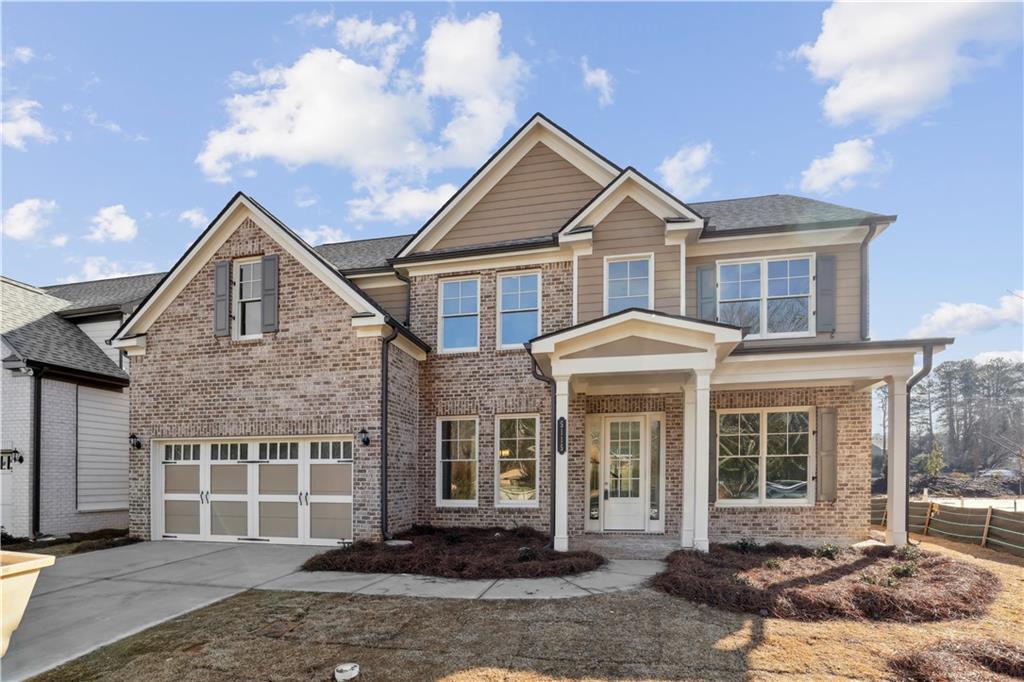 In Creekside Landing, a new home development of 41 homesites, this new WILLIAMSBURG floorplan is the dream home for which you have been waiting. Located in top rated North Gwinnett High School and North Gwinnett Middle School, a rare new construction opportunity for these great schools! This plan welcomes with a sunlit two-story entry foyer flanked by a living room/home office space and an elegant formal dining room. The foyer leads to a soaring two-story family room with open views to a bright, fabulous kitchen and breakfast. The kitchen has a large center island, white cabinets, quartz countertops, stainless steel appliances with a gas range and microwave. The breakfast area leads to a patio that is very private. Set in the heart of the cul de sac, the yard extends to wrap much of the cul de sac. This outstanding family plan provides five bedrooms, including a guest suite on the Main Level with a full bath with a frameless walk-in shower. Upstairs there are three more spacious secondary bedrooms that share a hall bath. The large primary suite provides a luxurious bathroom retreat featuring a garden tub, separate frameless shower and a spacious closet. All bath floors are tile with tile surround bathtubs and/or showers. All baths come with quartz countertops. Added bonus, the seller provides an electric car charge outlet in the garage! Construction is estimated to complete in September-October.