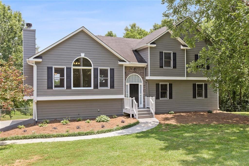 ***Professional pictures coming Tuesday, June 24***
Discover your dream home at this adorable mini farm! The heart of the home—the kitchen—has been completely transformed with state-of-the-art appliances, custom cabinetry, gleaming countertops, a chic backsplash, and a cleverly designed pantry featuring pull-out drawers for ultimate convenience. Upstairs, enjoy two spacious bedrooms and a full bath in the hallway. The primary bedroom and ensuite bathroom are just across the hall. The main level offers a bright great room with a fireplace and a soaring ceiling, a dining room with a picturesque view of the private backyard and cozy seating at the kitchen counter. Downstairs, you will find a large versatile family room, a fourth bedroom, a full bath, and a laundry room. Relax on the back deck with your morning coffee or evening beverage, soaking in the serene surroundings. This property includes a pond—your very own honey hole—perfect for casting a line anytime! As a unique bonus, the sellers’ friendly chickens and goat can stay with the property if you choose, adding a touch of countryside charm.