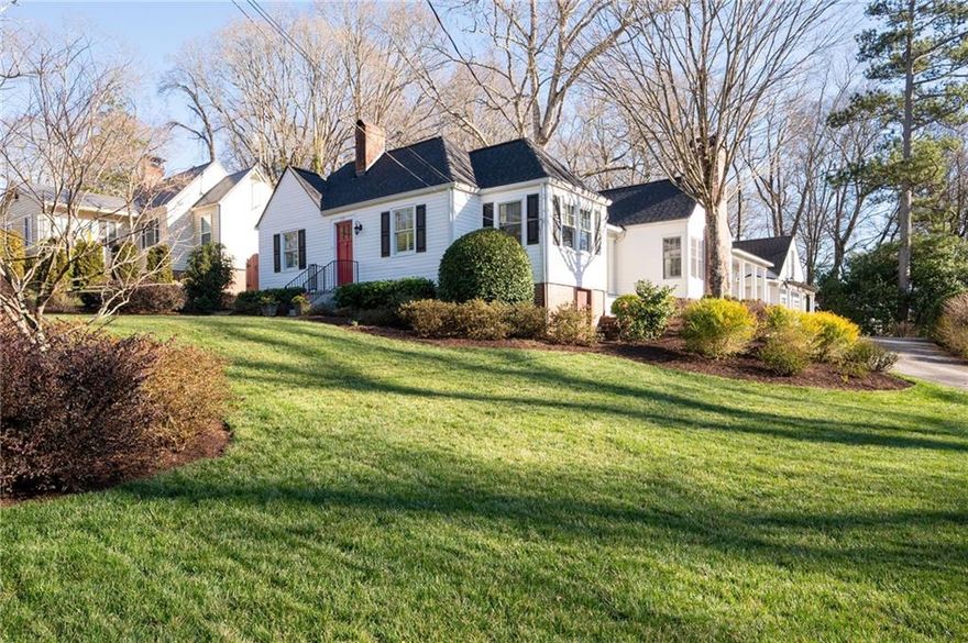 Featured in the book "Marietta - The Gem City of Georgia" as well as having been on the Tour of Homes, this well appointed GEM on Maple Ave is quite the catch!  More recently this house has become known for its beautiful landscape that could easily win Yard of The Month every month! With the pristine landscape, beautiful addition and upgrades including the stately colonnade to the carriage house w/ 2 car garage, this home is quite the showstopper on one of Marietta’s most beloved streets. Inside is just as spectacular with historical details paired perfectly with updated open living. This 3 bedroom 3 bath home (2 bed/2 bath in the almost 2K sq ft main house with another 600 sq ft 3rd bed and bath, in the carriage house) has been meticulously maintained! From the circular drive you will find the back porch entrance overlooking a stunning terrace with a beautiful brick fireplace. Step inside this amazing home and see the spacious family room with vaulted ceilings with wainscoting & the 2nd of 3 fireplaces. 2 lovely built-in bench seats flank the fireplace giving you a perfect spot to curl up with a good book. The family room is open to the kitchen separated slightly by 2 more beautiful columns and clever architectural details that make this home such a unique and stylish space. The custom built island is the heart of this kitchen w/ glass front cabinets, fabulous molding & lighting inside 
as well as under the cabinets. Dining room has built-in bench seating & recessed cabinetry that is a beautiful reminder of the great history of the home and the details of that era.  There is also a side porch, the perfect spot to sit and enjoy sunset. Wandering on to the front of the home you will find the formal living room w/ 3rd fireplace & gas logs as well as a built-in bookcase leading to cheery office w/ so many windows, built-in desk & beautiful wood paneling.  The primary suite is on the back of the home giving you great privacy, w/ french doors that lead out onto the back porch overlooking the terrace. Private bathroom w/ custom cabinets that will give you a place for everything along w/ a walk in closet. 2nd bedroom on the front of the home adjacent to hall bath which features walk-in shower all updated in classic tiles that will never go out of style! A back hall connects both bedrooms to the laundry room and additional closet space as well as a built-in pantry.  Beautifully restored hardwood floors & plantation shutters throughout the main house show how no detail has been overlooked. Just steps from the back porch is the most amazing terrace w/ fireplace and even a second patio area with a large brick outdoor kitchen complete with a gas grill and sink.  The mixture of bricks and natural stones give such a warmth and nod to timely elegance rarely found these days.  You can access the carriage house from the back terrace or with just a few steps through the colonnade that takes you into the garage and to the staircase leading you to the 3rd bedroom and private bath with great storage. This could be a perfect STR. Garage has room for 2 cars as well as work space. This house is a must see and you will not believe the yard come spring when everything start to bloom. Lots of great flowering bushes make it easy to maintain. So much love and care has been put into this yard, including a sprinkler system. The main house also features a fire sprinkler system, brand new roof, and exterior paint.  HVAC and water heaters have been replaced in the last few years so nothing to worry about in this lovely home.  Now let’s talk about the location!!  Maple Ave is sought after for many reasons, top schools being one, but the holiday orbs turn this street into a winter wonderland.  The Halloween parade is a must see! A short stroll to the Marietta Square w/ the fun concerts, festivals, amazing restaurants and shopping.  The MTR trail & the Kennesaw Mt Nat'l Park all right in the area. It really doesn’t get any better than 255 Maple Ave!
