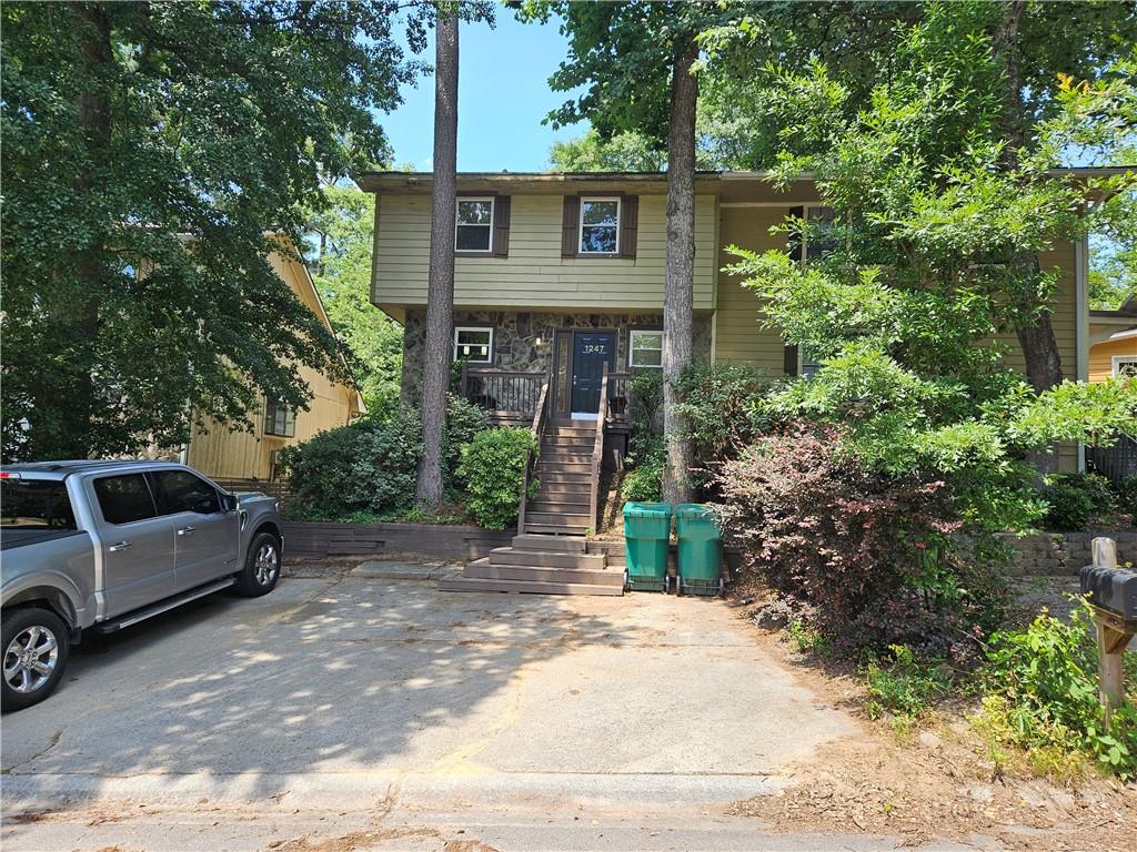 Coming Soon, Great 3 level townhome, walk to Truist Park. ADU with Living room, bedroom, Kitchenette and Bath. Great opportunity for Short Term Air B and B possibilities. Open Floor Plan. Remodeled Kitchen with stone counter tops, stainless steel appliances, including Gas range and refrigerator. Hard floors, large deck. Private fenced yard with gardens. Don't let this opportunity slip by