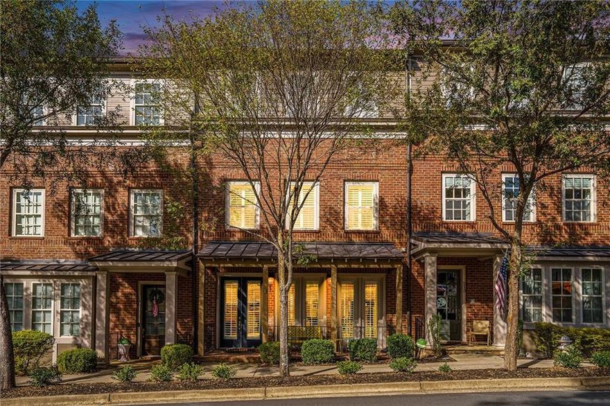 Step into a luxurious lifestyle in this four-story, elevator-equipped townhome in Meeting Park - one of Marietta’s premier communities - just steps from Historic Marietta Square.  Entering the home’s main level you find 10’ ceilings, new hardwood floors (with a no fee transferable lifetime warranty), and plantation shutters throughout.  Relax on the front porch, or gather in the fireside living room which is adjacent to the dining area.  At the heart of this open concept level is the chef’s kitchen which seamlessly connects the living/dining areas with a bright sunroom.  Across from the kitchen you step out onto the rear veranda.  An updated half bathroom completes this level. 
Take the convenient elevator or the stairs to the third floor’s primary suite with its crown moulding, large custom walk-in closet (with built-in safe), and large bath featuring a freestanding tub and frameless shower.  Also on this level is a second bedroom with ensuite bath and the laundry room with its new LG washer and dryer.
The hardwood flooring and plantation shutters continue throughout the third and fourth floors.  The fourth level highlights another large bedroom, ensuite bath, and large living space which is ideal as a guest suite or entertainment area.  This level is completed with a rooftop deck that offers panoramic views of downtown Marietta and Kennesaw Mountain.  An ideal space for watching sunsets, fireworks and other gatherings.
On the terrace level you find a mudroom drop zone across from the elevator which makes it easy to organize groceries, bags and other daily essentials.  Here also is a large bonus room with custom built-in storage, vibrant mural and full bath - a great guest suite, gym, office or playroom.  The two car garage features epoxied floors and an abundance of overhead storage.
The Meeting Park community offers amenities including a pool, dog park, pocket parks, fire pits and plenty of guest parking.
The list of updates to this home is long but primary among them are two Lennox high efficiency HVAC units installed in February 2025 with a no fee transferrable warranty, hardwood flooring and new lighting throughout.
This luxury home has been upgraded, meticulously maintained and provides the convenience of move-in ready for discerning Buyers who appreciate the close by amenities found in Marietta Square such as shops, restaurants, wine bars, museums, trails, and numerous year around events (with the added convenience of no parking hassles!)