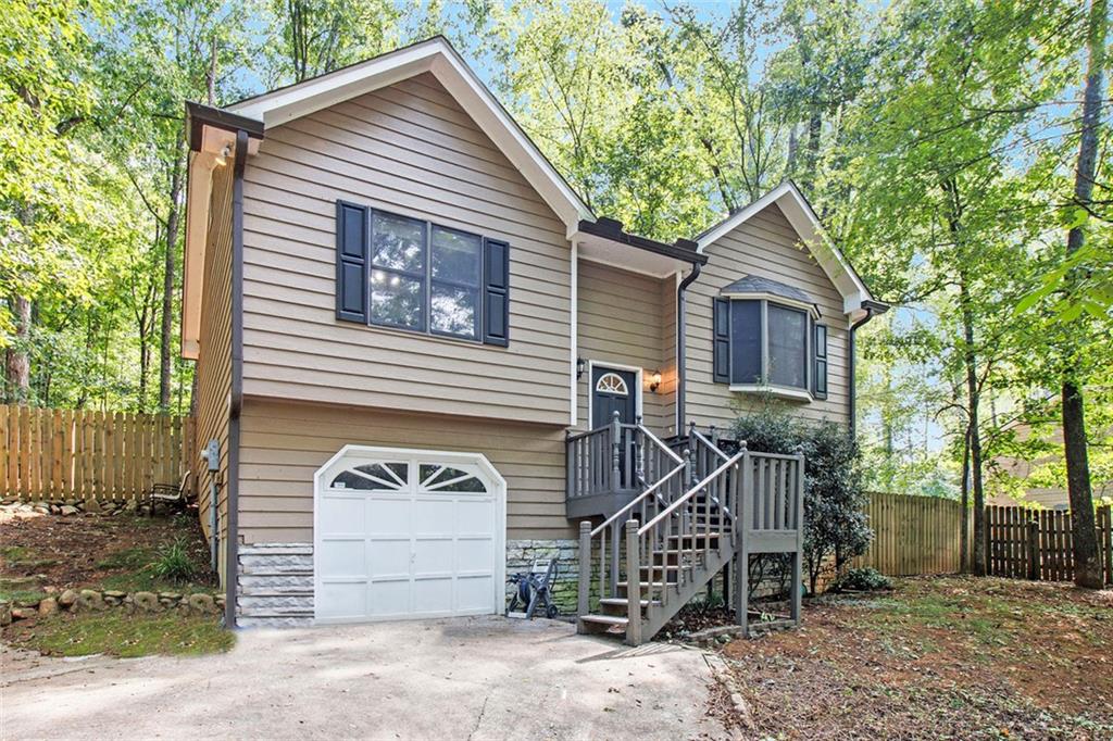 Looking for privacy, personality, and no pesky HOA? You’ve found it! This charming split-level home is tucked into the trees on a nearly half-acre wooded lot, offering a serene, cabin-in-the-woods vibe — but you're still minutes from everything in Cartersville!
Inside you'll love the open living space, stylish wainscoting, and a kitchen that shines with stainless appliances and loads of natural light. The home has 3 comfy bedrooms, 2 full baths, and all the charm you'd expect in a quiet, established neighborhood.
Outside? It’s a dream! Imagine roasting marshmallows around the firepit, relaxing on your oversized deck, or getting crafty in your shed/workshop. The fenced backyard is pet-ready, and the big front yard keeps things nice and private. Roof is only 7 years young, HVAC was replaced in 2022, and there's no HOA drama here!
Whether you're a first-time buyer, downsizing or looking for that perfect second home escape, this home checks all the boxes!
Located just minutes to downtown Cartersville, schools, shopping, and dining — yet set in a quiet, established neighborhood — this move-in-ready gem combines comfort, convenience, and character. Come see it today!