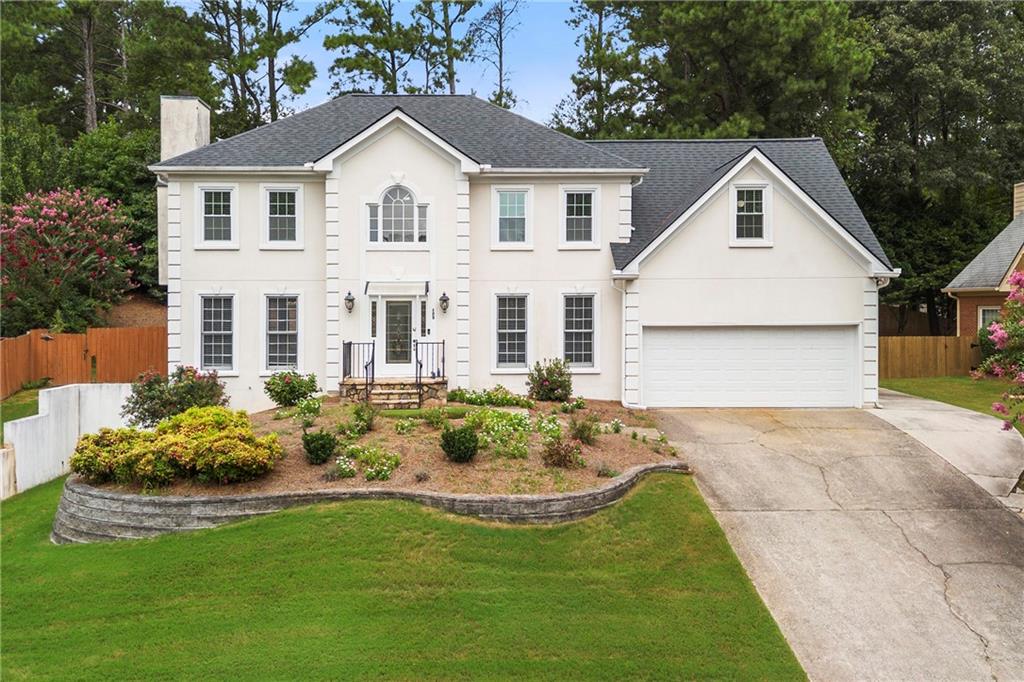 Welcome to this stately 5-bedroom, 3-bath home in the highly sought-after Tuxford neighborhood! Step inside to a beautiful two-story foyer that sets the tone for this elegant residence. The spacious family room boasts soaring cathedral ceilings, a stunning stone fireplace that extends to the ceiling, and walls of windows that fill the space with natural light. A formal dining room and flexible office space/living room add timeless charm and versatility. The main level also features a convenient guest bedroom with a full bath. The kitchen is both functional and stylish with granite countertops, breakfast area, island and home command center—perfect for everyday living and entertaining. Upstairs, retreat to the luxurious primary suite complete with a cozy fireplace, spa-inspired ensuite with dual sinks, soaking tub, and a walk-in closet. Three additional bedrooms offer plenty of space for family or guests. The unfinished basement provides endless opportunities to create the space you’ve been dreaming of—whether it’s a home theater, gym, or playroom. Enjoy the oversized deck overlooking a private backyard, perfect for year-round relaxation and gatherings. Living in Tuxford means access to premier swim/tennis amenities, top-rated schools, and unbeatable convenience. You’re just minutes from GA-400, Avalon, Halcyon, North Point Mall, Webb Bridge Park, Ocee Park, and some of North Atlanta’s best shopping and dining. This exceptional home combines elegance, comfort, and location—all within reach of your lifestyle goals.