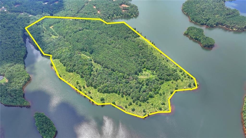 An amazing picturesque and flat 86.57 acre peninsula land for sale which is surrounding by the tranquility of the Hard Labor Creek Reservoir.

This reservoir is a 1,370-acre artificial reservoir with the average depth of 82 feet. There is day parking, a boat ramp facility and modern rest room houses in operation around the reservoir.
This peninsula land is 40 miles (64 km) east of Atlanta, around one mile to the wonderful state park, Hard Labor Creek State Park. Also it is located 3 miles from the Rivian EV Plant Site and 4 miles to the Stanton Springs Date Center .

Owner of this land has been told by the officials of Walton County that this land can be developed to a subdivision with 2 acre lots. An experienced developer predicted this can be divided into 36 to 40 lots. It has the potential for marketable million dollar or higher value homes due to location near Hard Labor Creek Park, which is known for its golf course, wide range of recreational opportunities in a beautiful, wooded setting. A lakeside beach is popular with swimmers during summer months with more than 24 miles of trails available for hikers and horseback riders. Horse owners even have their own private camping area near stalls. Other overnight guests can choose from fully equipped cottages or a modern campground.

Another real estate positive driver is the increaseing job opportunities. Many Jobs have been created by the Data Center and surrounding warehouses. Additionally, another huge job opportunity is planned by Rivian EV plant.