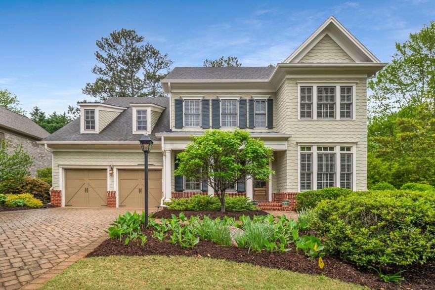 Welcome to timeless elegance in the exclusive, gated Creekside Place enclave of Windward. Ideally located steps from The Golf Club of Georgia, this stunning home seamlessly blends classic charm with modern luxury. A grand two-story foyer welcomes you into an open, airy layout perfect for everyday living and entertaining. The chef's kitchen is a true showstopper outfitted with high-end appliances, marble countertops, a large eat-in island, a walk-in pantry, & Butler's pantry. The kitchen flows effortlessly into a formal dining room and a cozy fireside living room featuring beautiful, coffered ceilings. Step outside to a spacious stone patio overlooking a tranquil, wooded backyard your own private retreat. A convenient guest suite and a private home office complete the main level. Upstairs, 9-foot ceilings enhance the sense of space across four generously sized bedrooms all with hardwood floors. The crown jewel is the luxurious primary suite, a private retreat featuring an oversized spa-inspired bathroom, Quartz countertops, his-and-hers walk-in closets, and a versatile dressing room perfect as an additional closet, small office, or a serene sanctuary. Windward offers resort-style amenities including The Golf Club of Georgia, Lake Windward, a marina, an award-winning swim and tennis center, sports parks, playgrounds, and direct access to the Greenway; most of which is walkable from the home. And just minutes from GA-400, Avalon, Halcyon, and Downtown Alpharetta. 201 Hunley Court is a rare find schedule your private showing today and experience the best of Windward living.