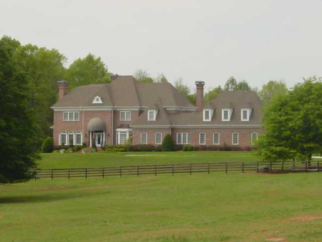 190+ ACRES SURROUND THIS MAGNIFICENT HOME & EQUESTRIAN AREA. 5 FIREPLACES, WINE CELLAR, POOL & PAVILION, 3 LAKES. OTHER BLDGS INCLUDE 4BDRM MANAGER'S HOUSE, 3 BARNS & INDOOR AREANA.