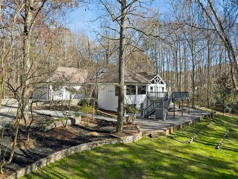 Stunning custom executive home on a lovely neighborhood in top rated Pope High District. Looking for a unique home w/many high end features that are missing from today's typical luxury homes? This is the one! Surround by nature , this 2 acres property is an unique property that brings you elegancy, high end features and comfort. Home boasts exquisite character throughout & unique floorplan. You will feel the spaciousness of each room & notice many special features: oversized rooms, front and back view to nature and river streams, full of privacy, modern bathrooms designs and so much more.Gourmet kitchen w/huge island, breakfast bar, custom cabinets, high end appliances & walk in pantry.Stunning floors, large breakfast room all open to kitchen. Luxury owners retreat w/sitting area & FP facing natural water, huge custom walk-in closet, spa bath, guest BR Suite, powder room, ladies desk, mud room, laundry, 3 cars garage , a Barn for extra storage space.The terrace level is spectacular & ideal for relaxing & entertaining! This Home is completely renovated, all systems are new. Build with high quality! This is a custom built estate with a fabulous flat back and front yard. Yard has plenty of room if You desire a pool. A RARE opportunity well located in East Cobb attached to award winner schools.
